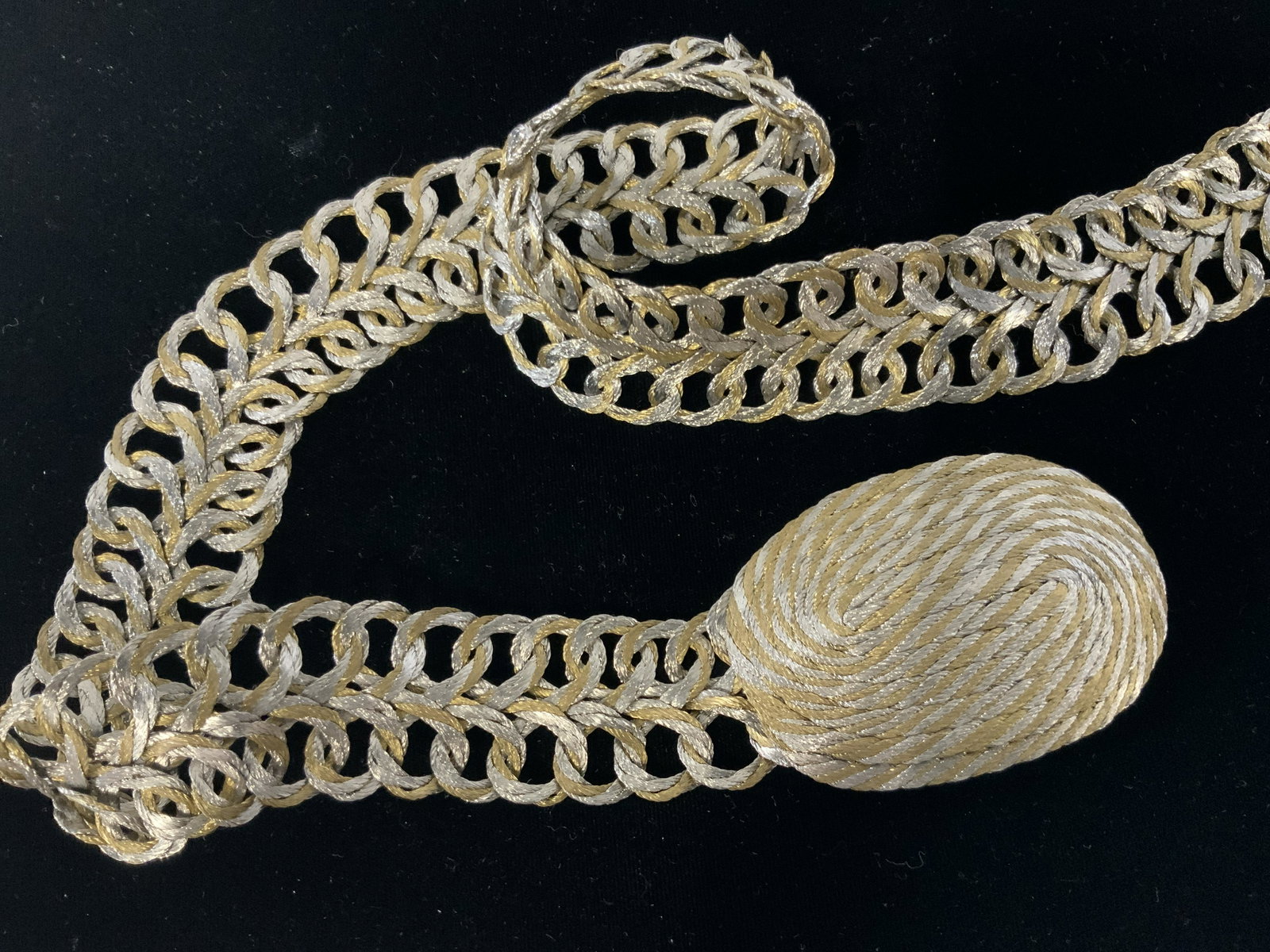 Vintage Wire Loop Belt: Vintage wire loop belt, soft wire twisted together to make a thick thread like material, in silver colored loops and gold, inter loop with each other to make two rows of interlocked wire ribbon, closu