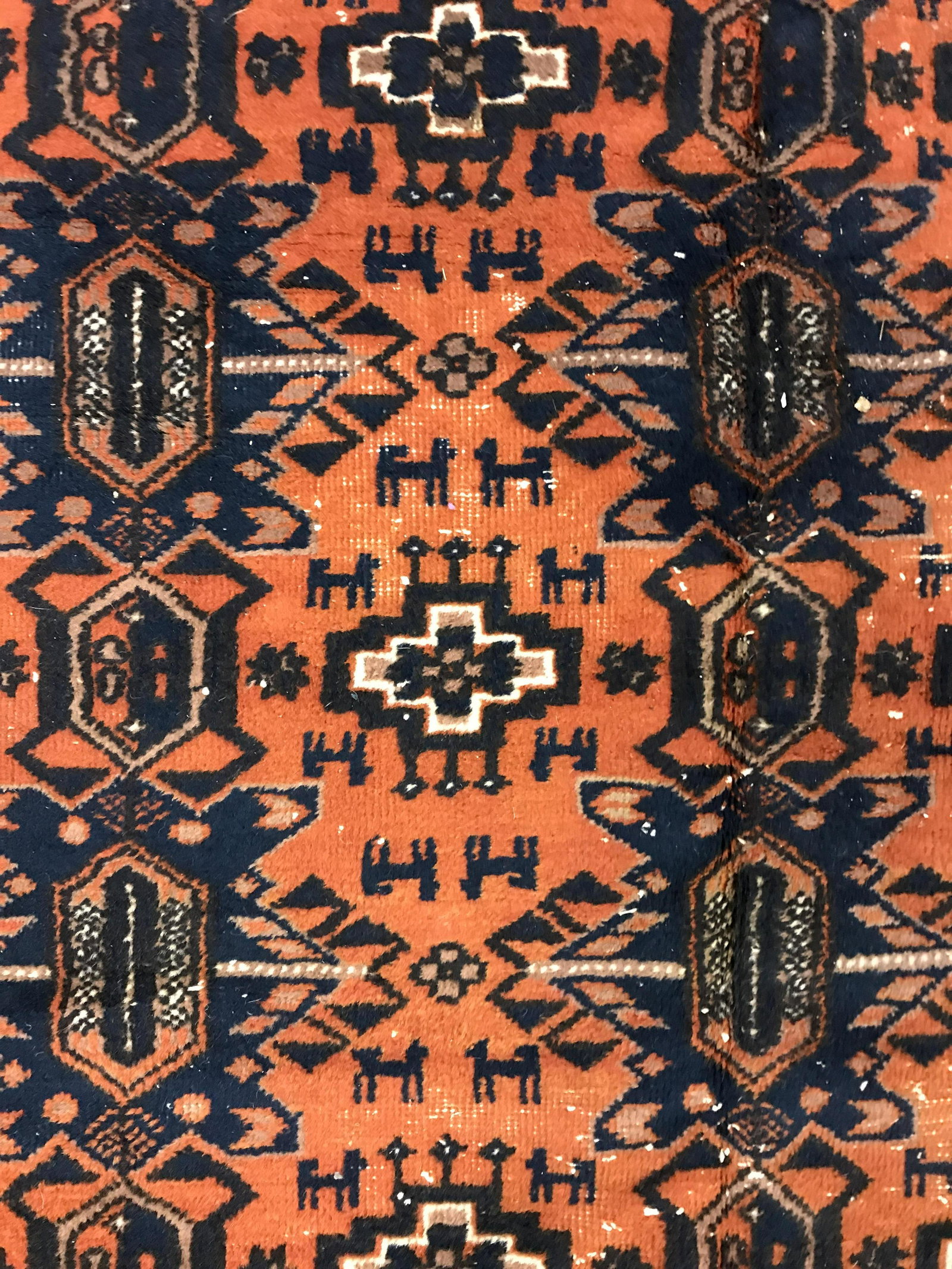 Vintage Wool Area Rug: Vintage wool are rug, edges are frilled, possibly antique. Depicts a multi toned southwestern motif. Wear is consistent with age and use. Measures approx 117 inches Long, and 72 inches W. Tribal theme