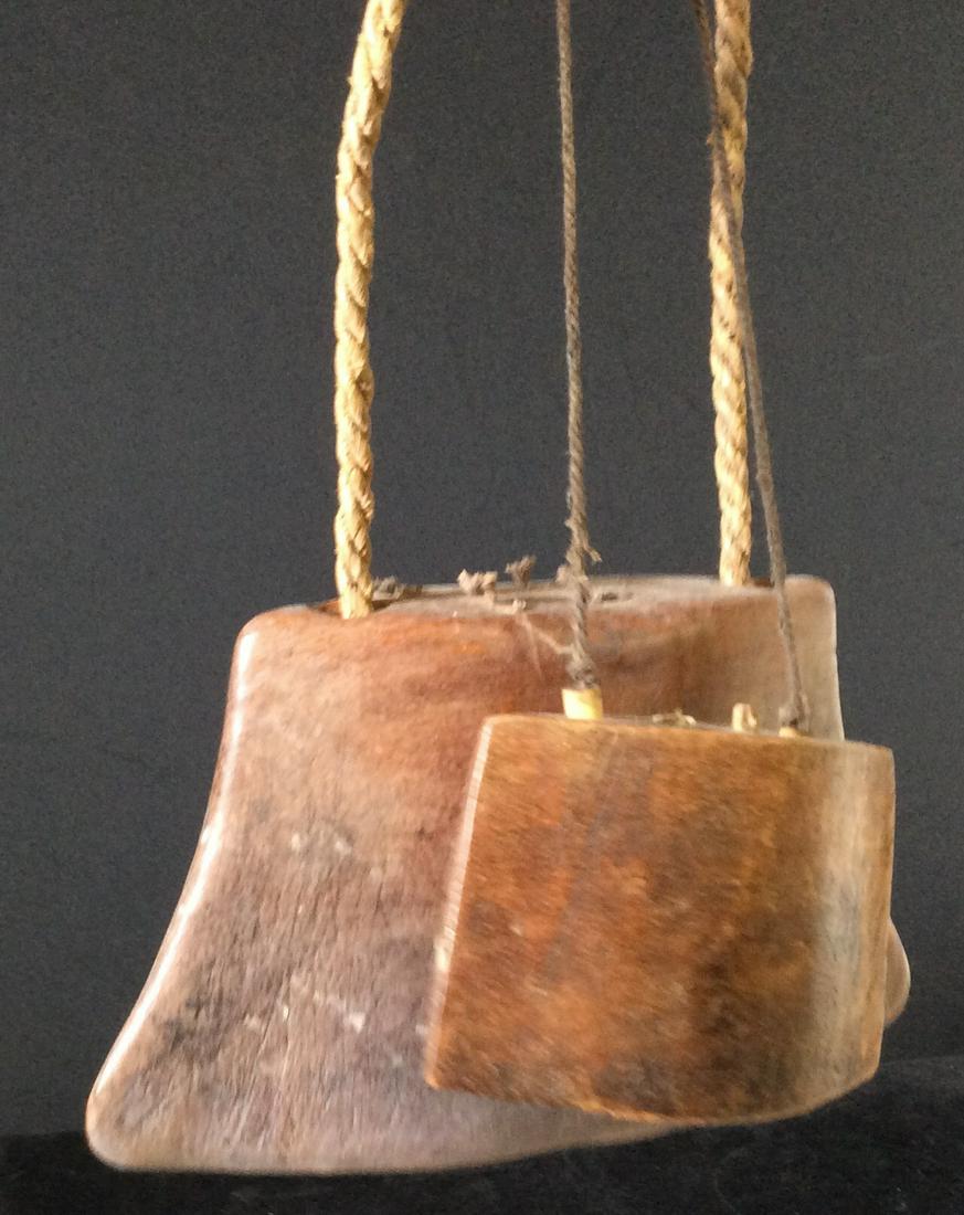 Lot 2 vintage Carved Wood Asian Cow Bells: Big and small cow bells. Rope handles. Hand carved Wood. Larger measures 8 x 4 in. Smaller bell uses Asian coin ringer. Vintage Collectible Cow Bells, Farm Accessories, Country Home Accessories, Wood 