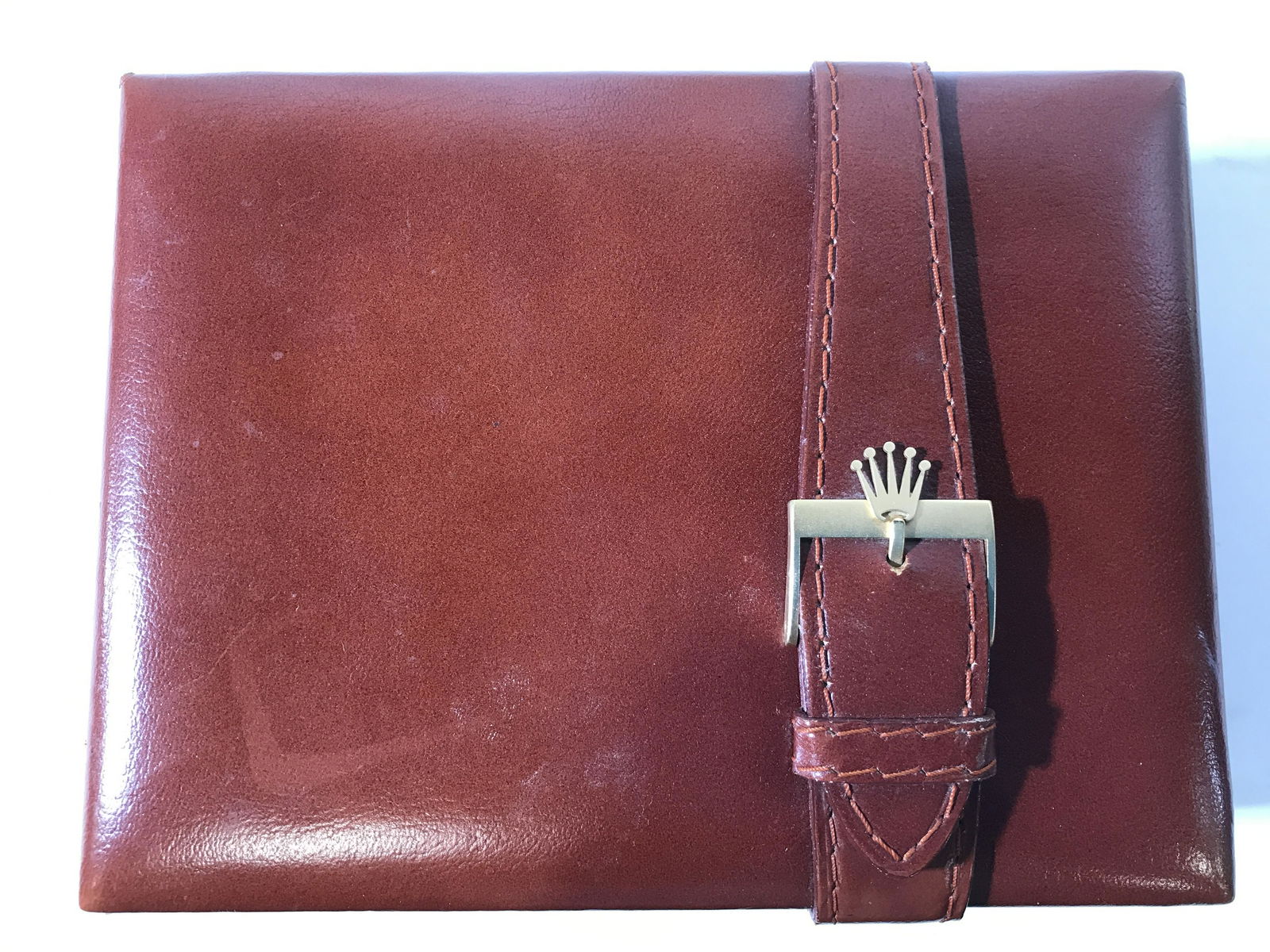 Leather Rolex Box W Wooden Interior: Interior and underside of box is marked ROLEX. Box has light mahogany tone and wooden interior. Rolex box, leather Rolex box, keepsake box, watch box, luxury watch box, accessory box. Piece measures a