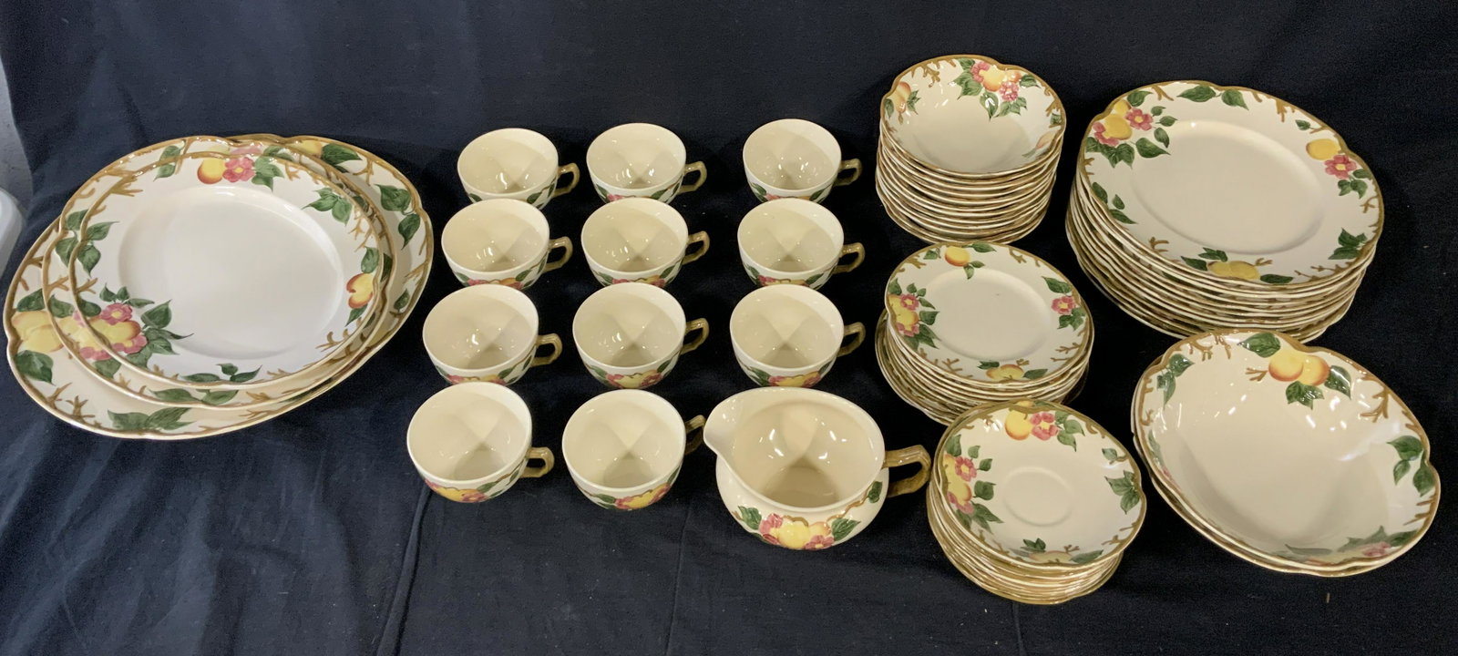 Lot 65 Johnson Brothers Ceramic Dishes & Teacups: Lot 65 Johnson Brothers Ceramic Dishes & Teacups, stamp to base of pieces reads ‘Peachbloom John Bros Made in England’, pieces have peach and flower design, sauce dish measures 6 5/8 inches at wid