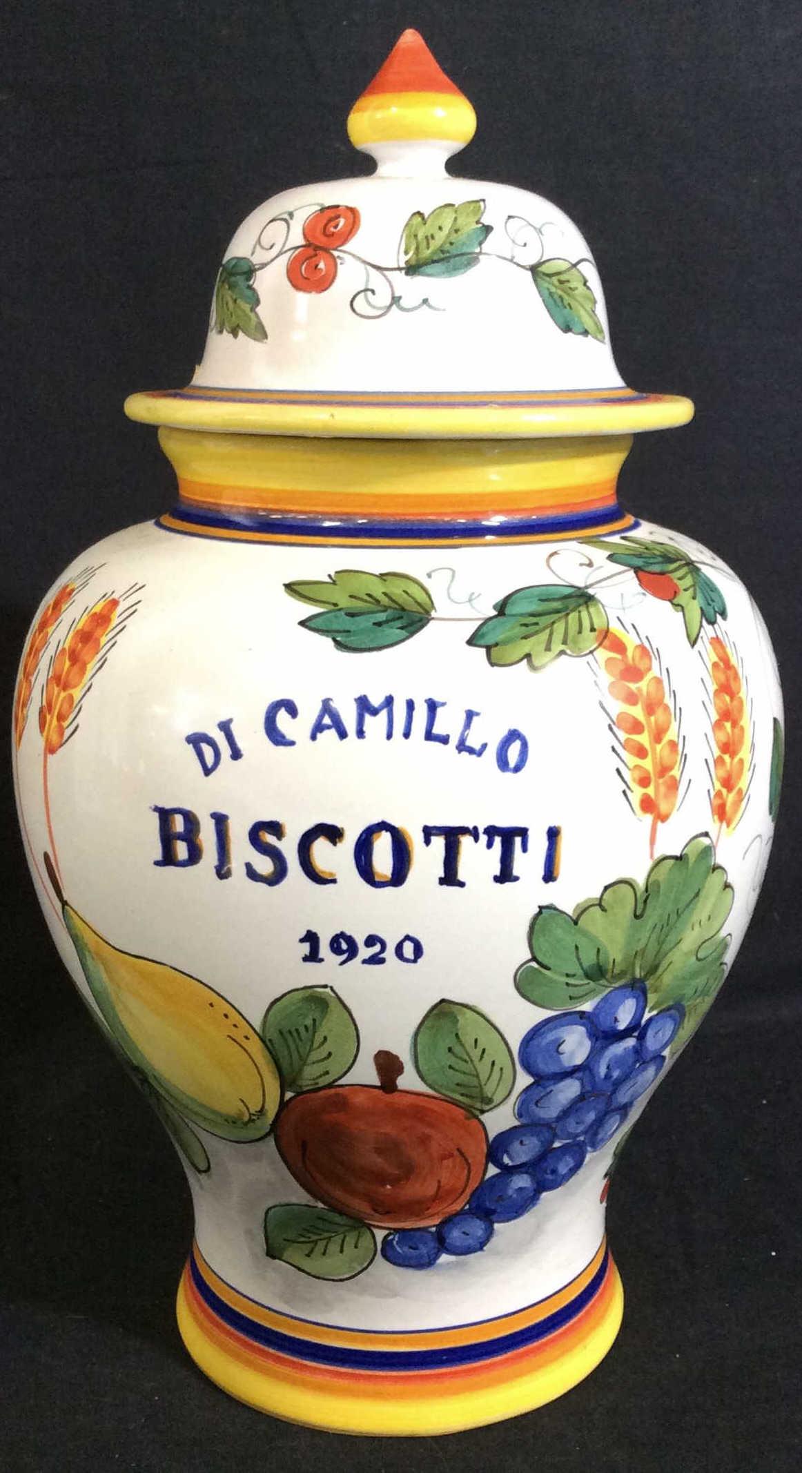 Hand Painted Deruta Ceramic Vessel, Italy: Ceramic jar with lid, Italian Made, decor depicts bright Fruit on vines. Front reads ‘Di Camilo BISCOTTI 1920’. Use as centerpiece, cookie jar, more. Underside reads Deruta. 12.5 in ht., W app 8 i