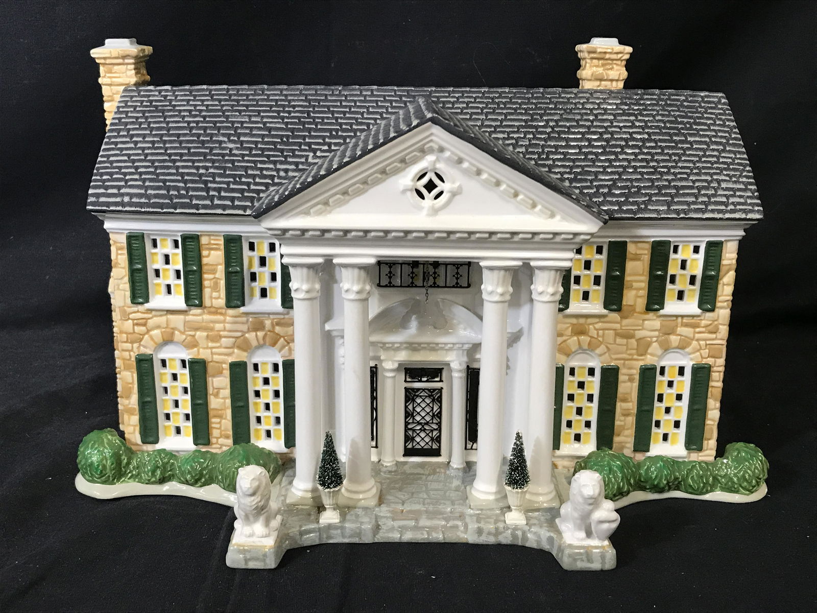 Vintage Ceramic GRACELAND Scale Model: Hand painted ceramic replica of GRACELAND, the former home of Elvis Presley. Underside reads as THE ORIGINAL SNOW VILLAGE SPECIAL EDITION ELVIS PRESLEYS GRACELAND DEPARTMENT 56. Includes a gate, one s