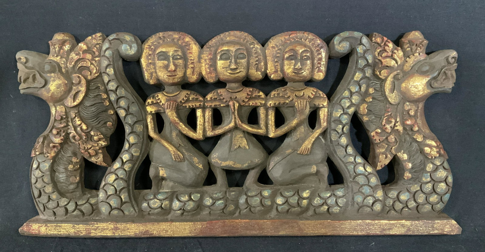 Far East Asian Dragon Boat Sculpture: Far East Asian Dragon Boat Sculpture, possibly Indonesian, no apparent inscriptions or signatures, three figures on a boat, measures 7 5/8 inches x 16 3/8 inches, red, gold, and blue pigment, pigment 