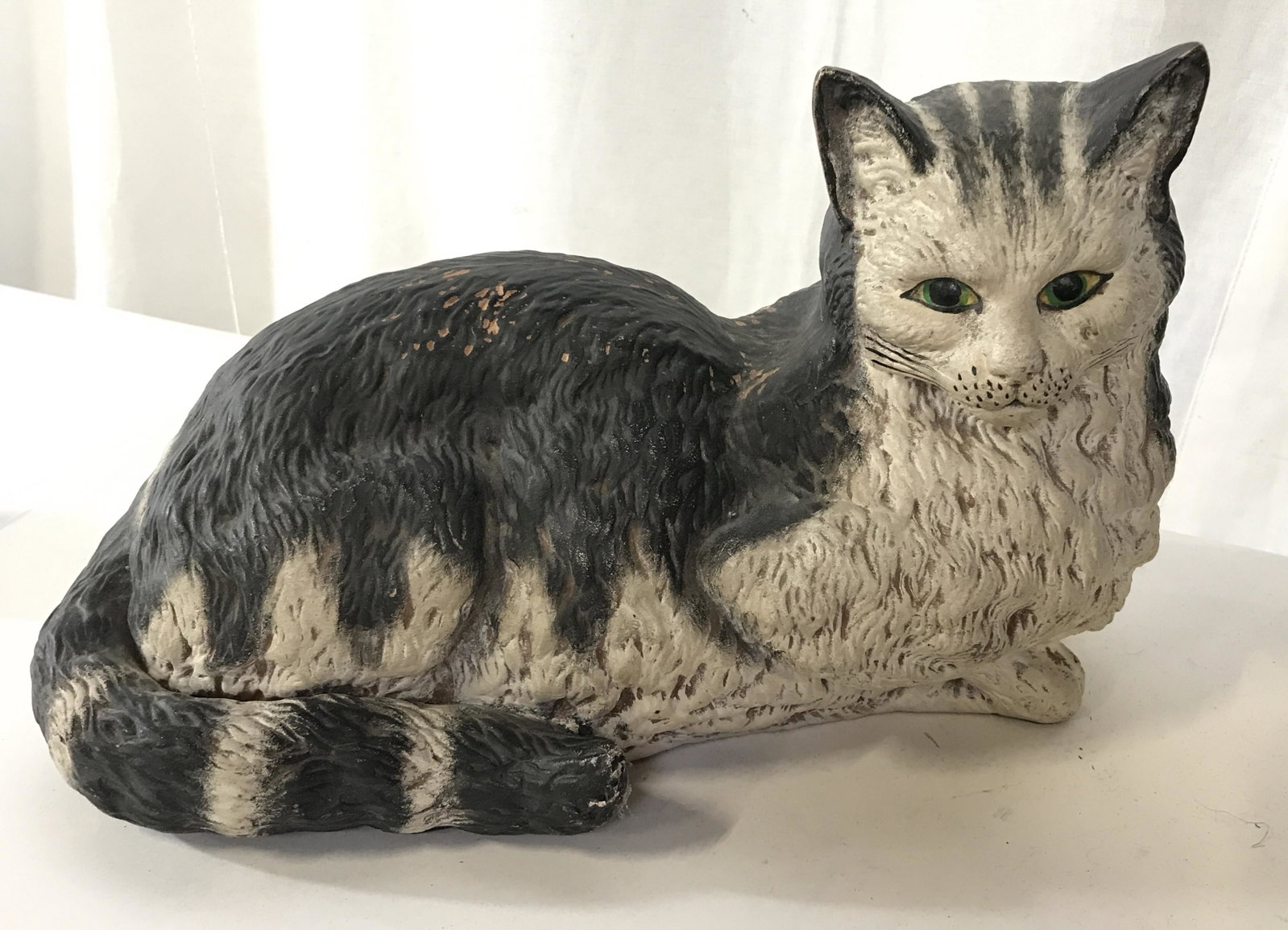 Vintage Hand Painted Earthenware Cat Figural: Vintage earthenware Long haired cat, the cat is hand painted in black and gray tones. Measures approx 7.75 inches H, 13 inches W. Wear is consistent with age. Cats, earthenware, hand painted ceramics,