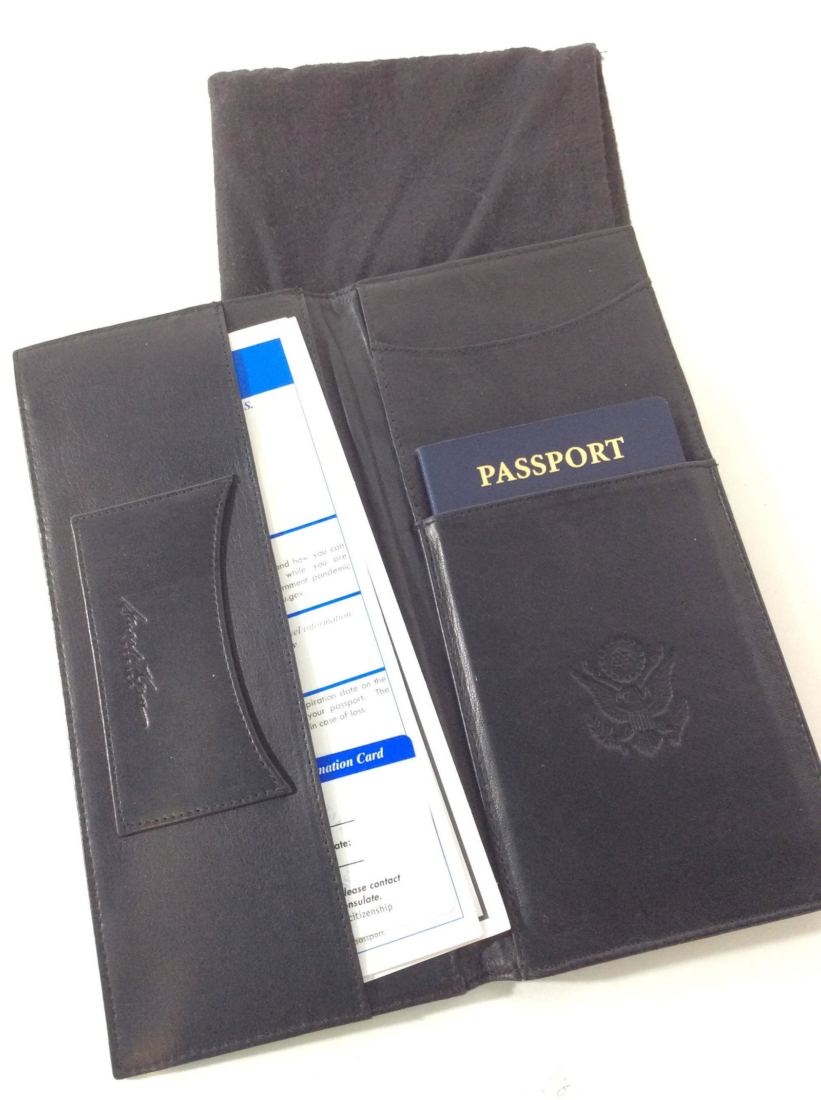 STUART KERN Leather Passport Holder: Black leather Bifold holder, Signed Stuart Kern. Leather soft hand and supple. Embossed with US Seal, 9.5 in. Ht, 4 3/8 in. Width. No leather issues to note. Comes with fabric leather Duster/ protecto