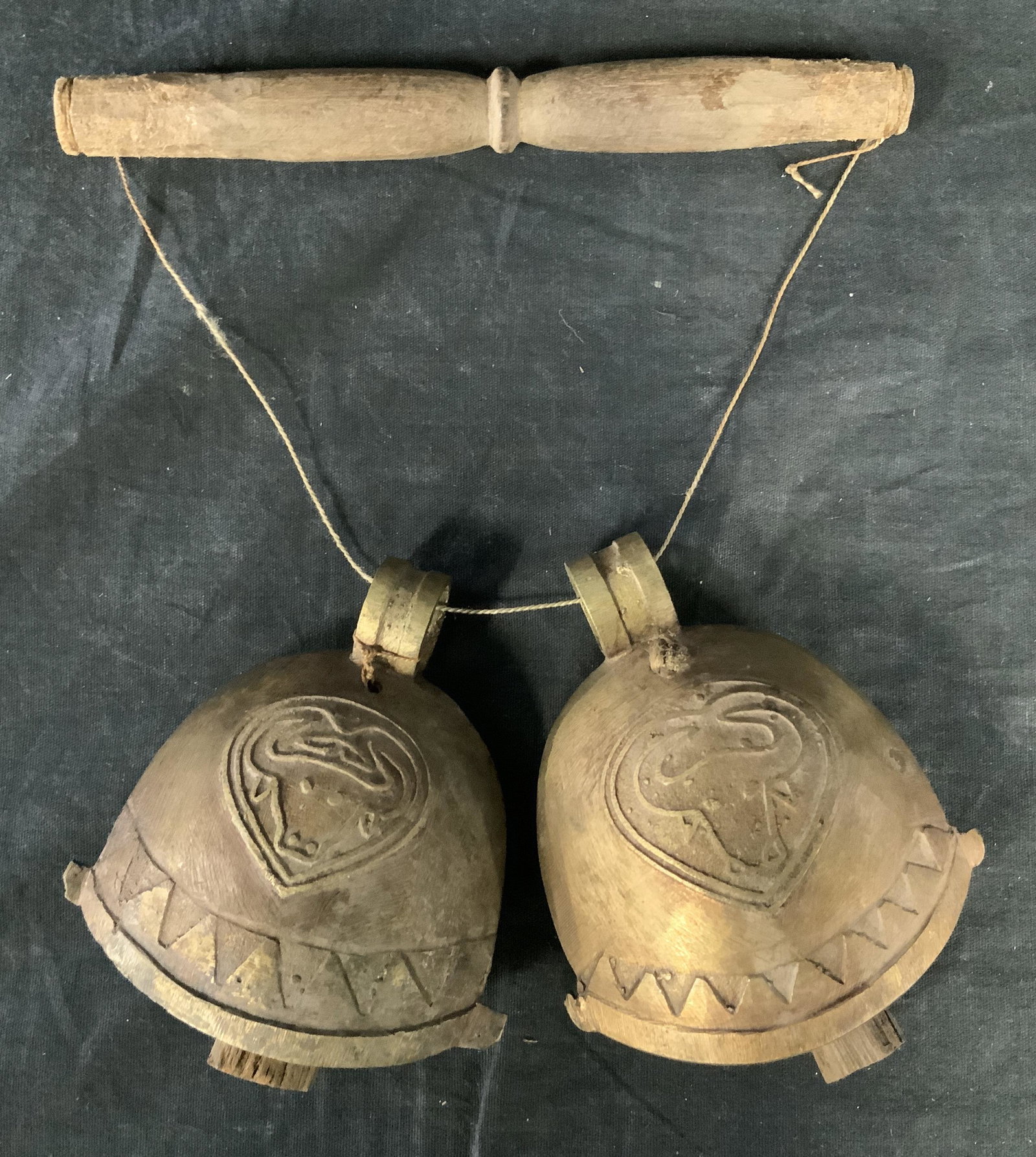 Far East Asian Collectible Cow bells: Far East Asian Cowbells, possibly Indonesian, no apparent inscriptions or stamps, possibly brass, embossed oxen on bells, wooden handle and clapper, some wear from use but overall in good condition, P