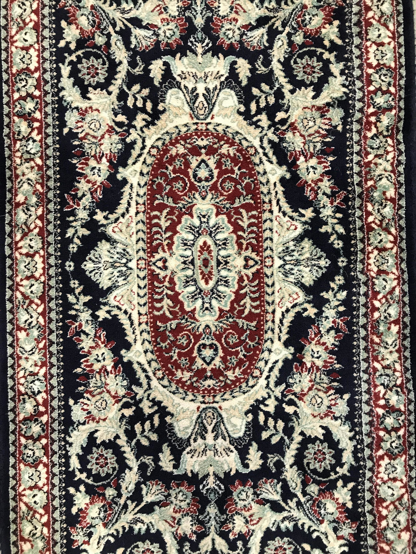 HOME DYNAMIX AUBUSSON Wool Runner: Runner is wool, appears to be handmade. Tag on underside reads HOME DYNAMIX LLC AUBUSSON MADE IN BULGARIA. Rug has fringes. Piece has intricate multi toned floral leaf and vine detail. Runner, wool ru