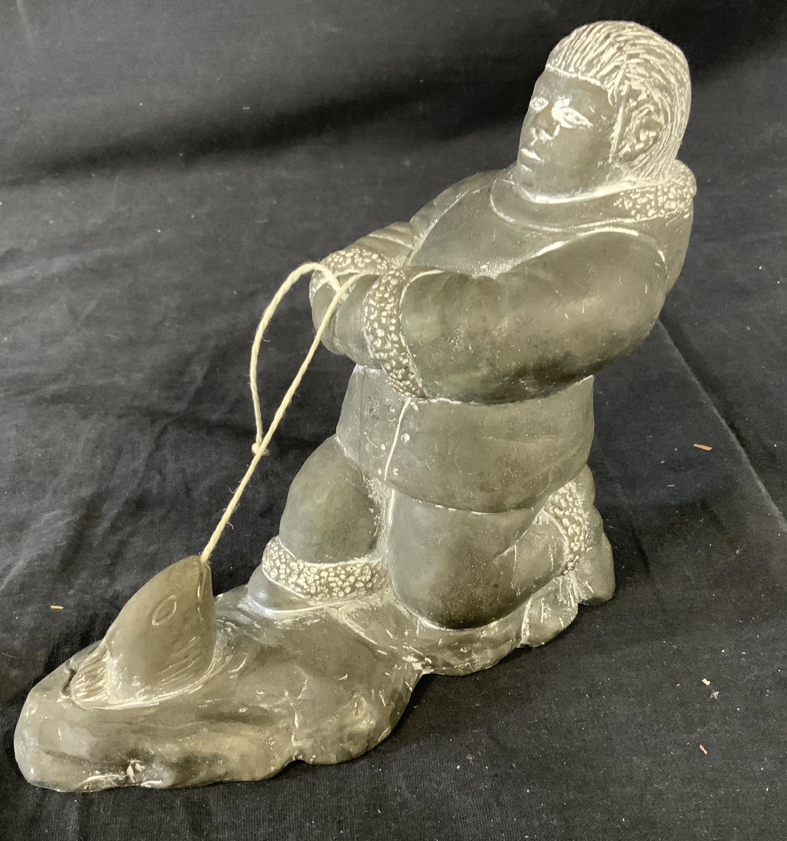 Vintage Aardvark Canada Soapstone Figurine: Vintage Aardvark Canada Soapstone Figurine, inscription to piece reads ‘Aardvark Canada 1972’, an indigenous man fishing, measures 6 1/2 inches tall X 7 inches at widest point, in good condition, 