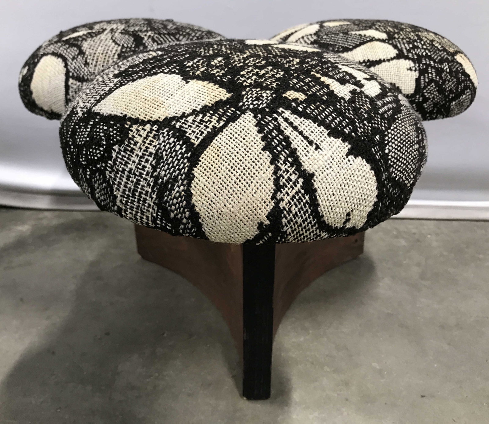 Wood Base 3 Cushion Upholstered Footstool: Footstool has wooden base. Piece is upholstered with cream & brown toned upholstery with floral & leaf detail. Piece measures approximately 14 inches tall 22 inches wide. Footstool, upholstered footst