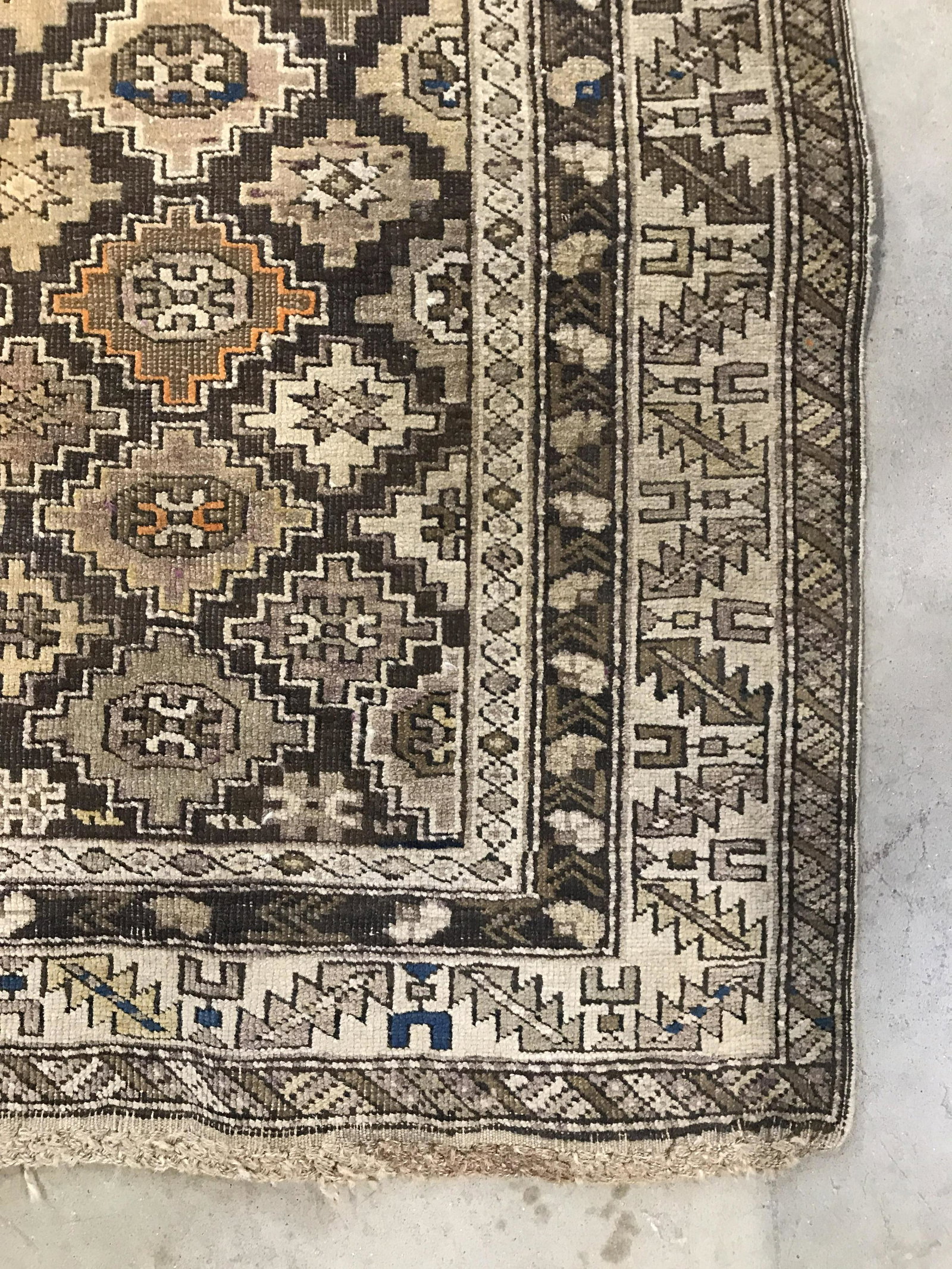 Vintage Handmade Caucasian Style Rug: Rug is wool and handmade. Piece is vintage possibly antique. Contains multi toned geometric detail. Rug has some fringes. Measures approximately 59 inches long 46 inches wide. Rug, carpet, area rug, w