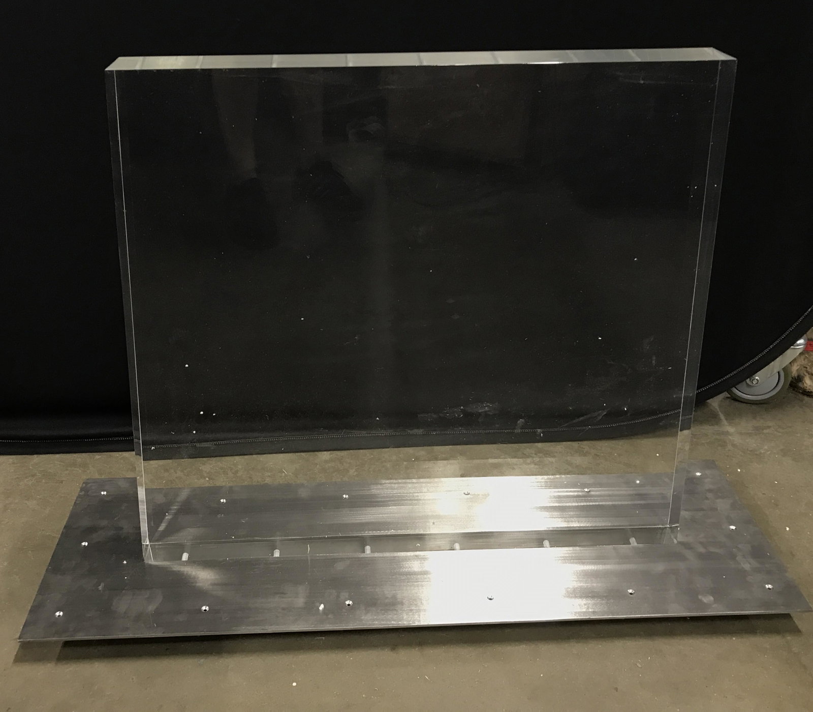 Chunky Lucite & Metal Console Table: Lucite & Metal Console table, needs top. Lucite body, brushed metal base. Lucite carved into trapezoidal figure. Possibly floor standing, possibly wall mounted. Measures approx 28.5 inches H, 40.5 inc