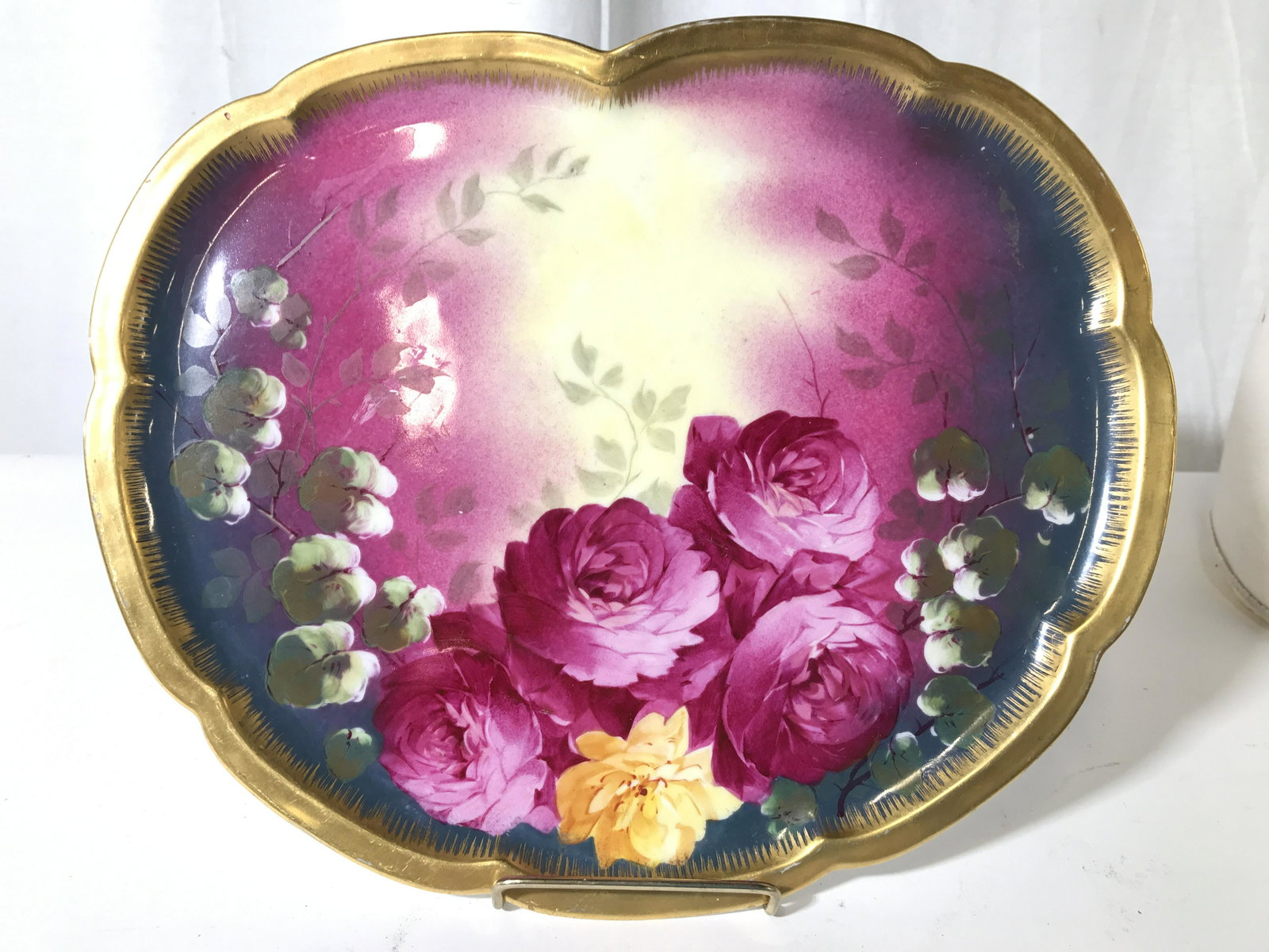 THEODORE HAVILAND LIMOGES FRANCE Decorative Plate: Backside is marked THEODORE HAVILAND LIMOGES FRANCE. Plate contains intricate multi toned floral and leaf detail. Edges are gold toned possibly gold leafed. Piece measures approximately 13 inches long