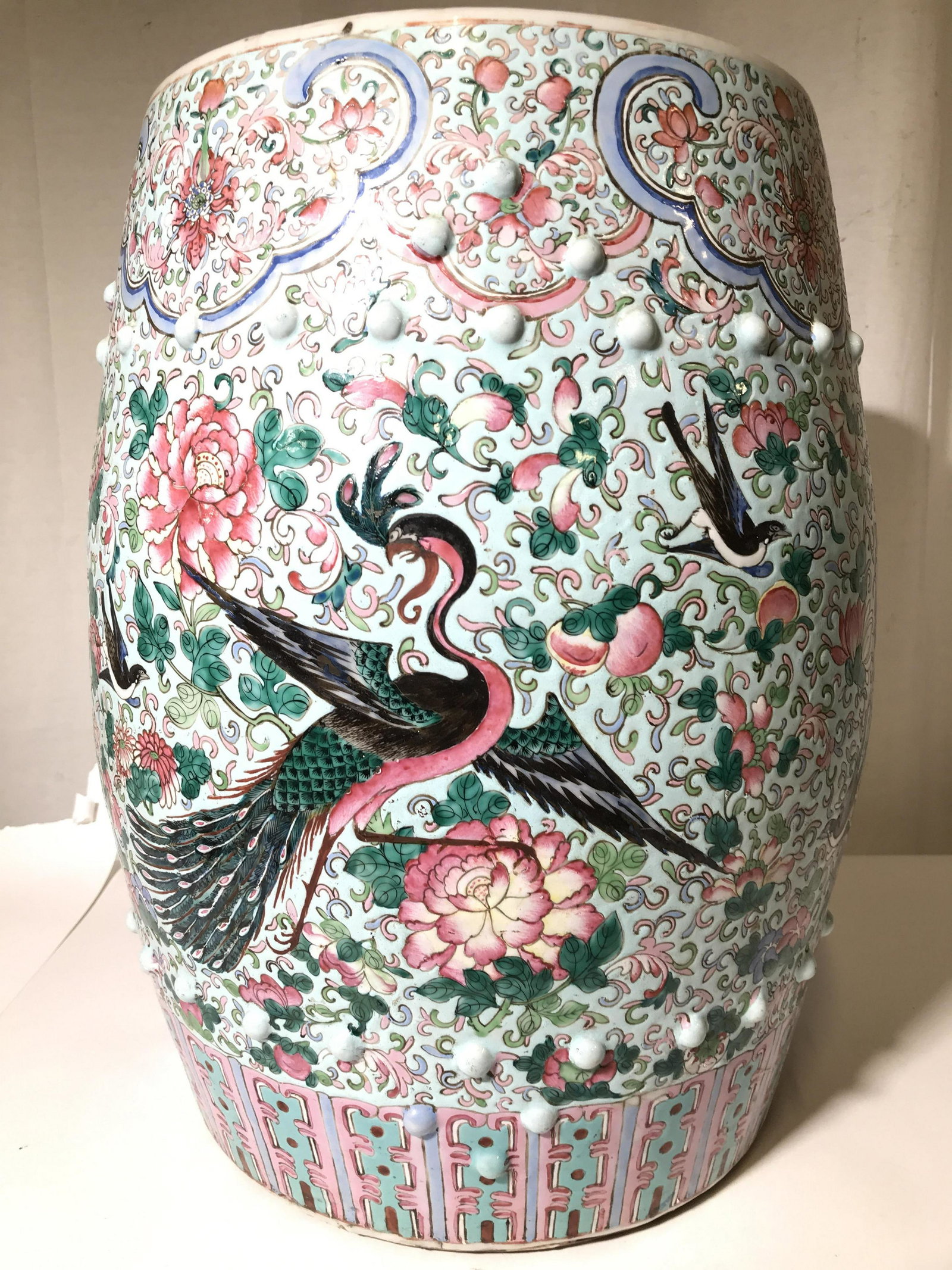 Antique Hand Painted Asian Porcelain Garden Stool: Garden stool is antique. Piece is porcelain. Contains intricate multi toned hand painted detail depicting flowers, leaves, birds, & various geometric shapes. Piece measures approximately 18.5 inches t