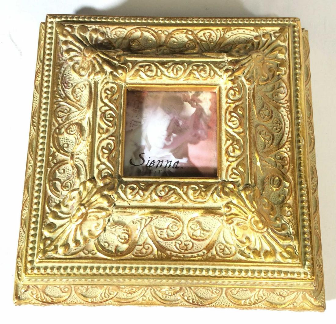 Sienna Decorative Victorian Style Wood Box: Embossed Wood Box, antiqued Green patina with popping gold leaf on in relief scrolls. Top opens on Hinge , 3 x 3 in. Photo can be inserted. Interior and underside all black felt. L X W 9.25 in sq. Ht