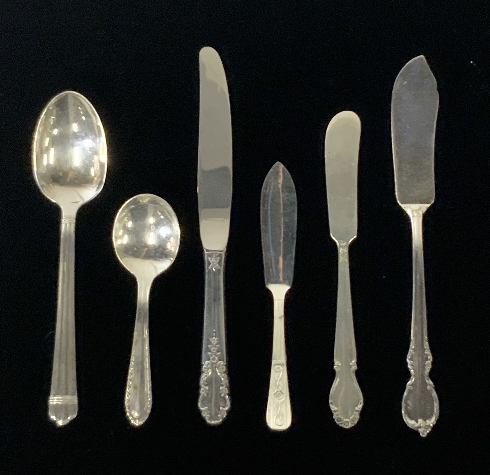 Lot of 6 Plated Tableware: SHEFFIELD, ROGERS BROS.: Assortment (6) of tableware from: Sheffield (spreader), Christofle (tablespoon), Rogers Sterling (spreader), 1847 Rogers Bros., (spreader) & Stratford Plate (smaller spoon). All tableware stamped with