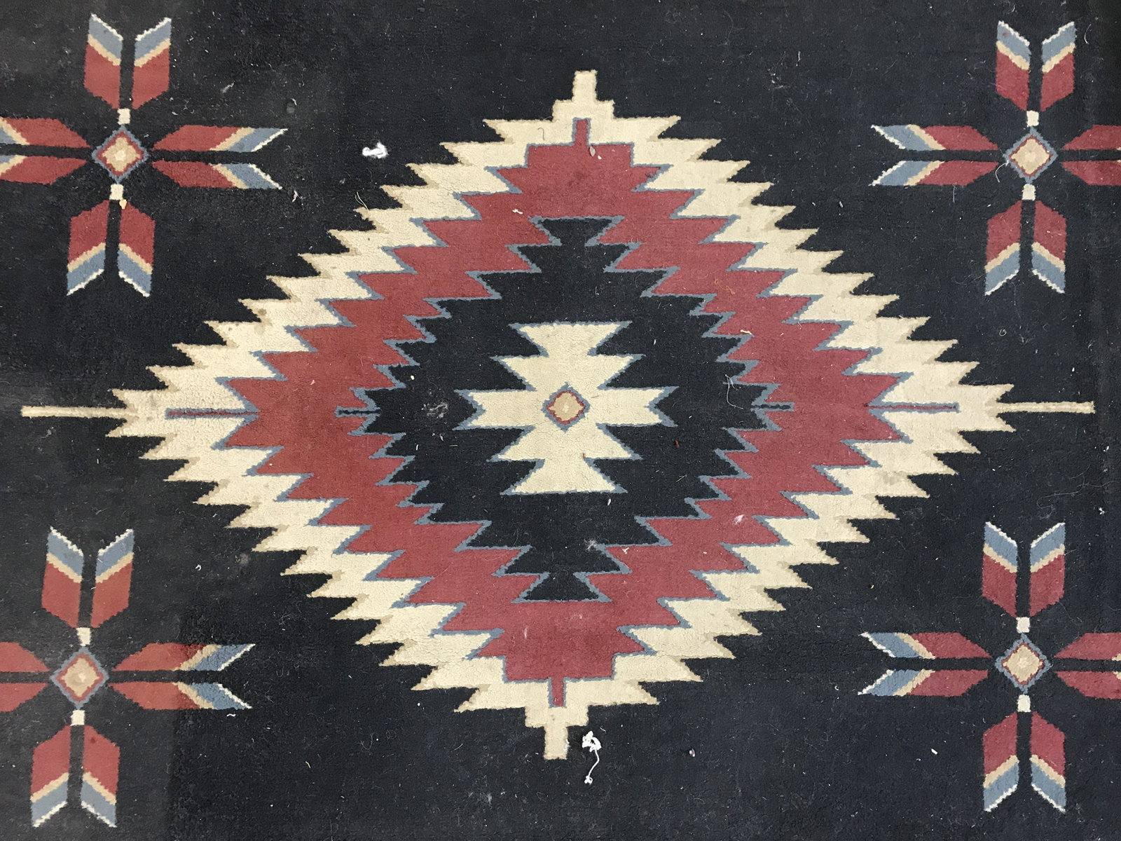 Vintage Southwestern Themed Wool Carpet: Vintage wool area rug, decorated with a multi toned southwestern-American theme. Ends are frilled. Measures approx 90 inches long, 67 inches W. Wear is consistent with age and use. Vintage decor, vint