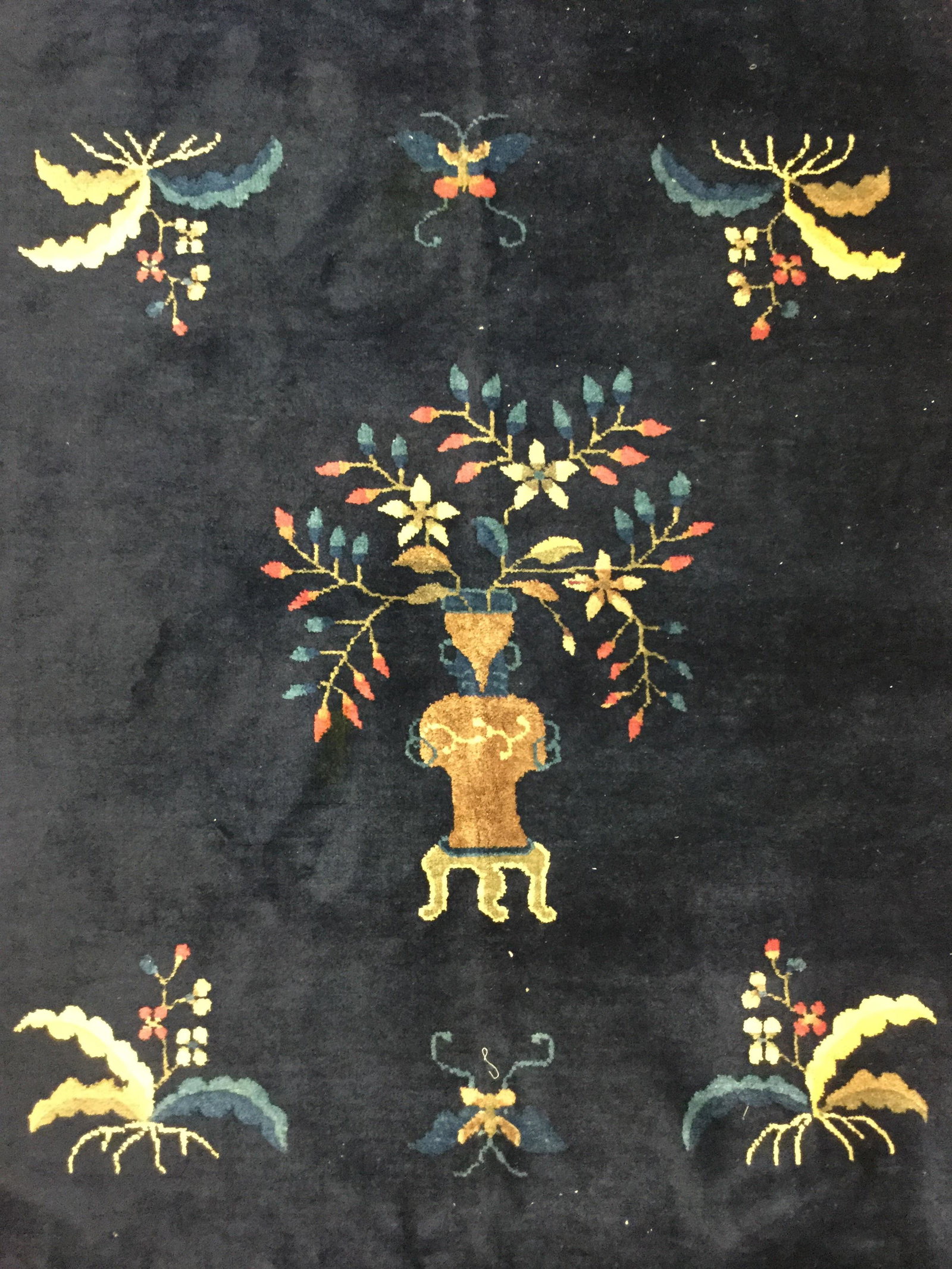 Vintage Handmade Chinese Art Deco Wool Pile Rug: Rug is wool pile and handmade. Piece is vintage possibly antique. Rug contains floral, leaf, vine, & vase detail. Rug, carpet, area rug, wool rug, Chinese Art Deco rug, handmade rug, wool pile rug. te