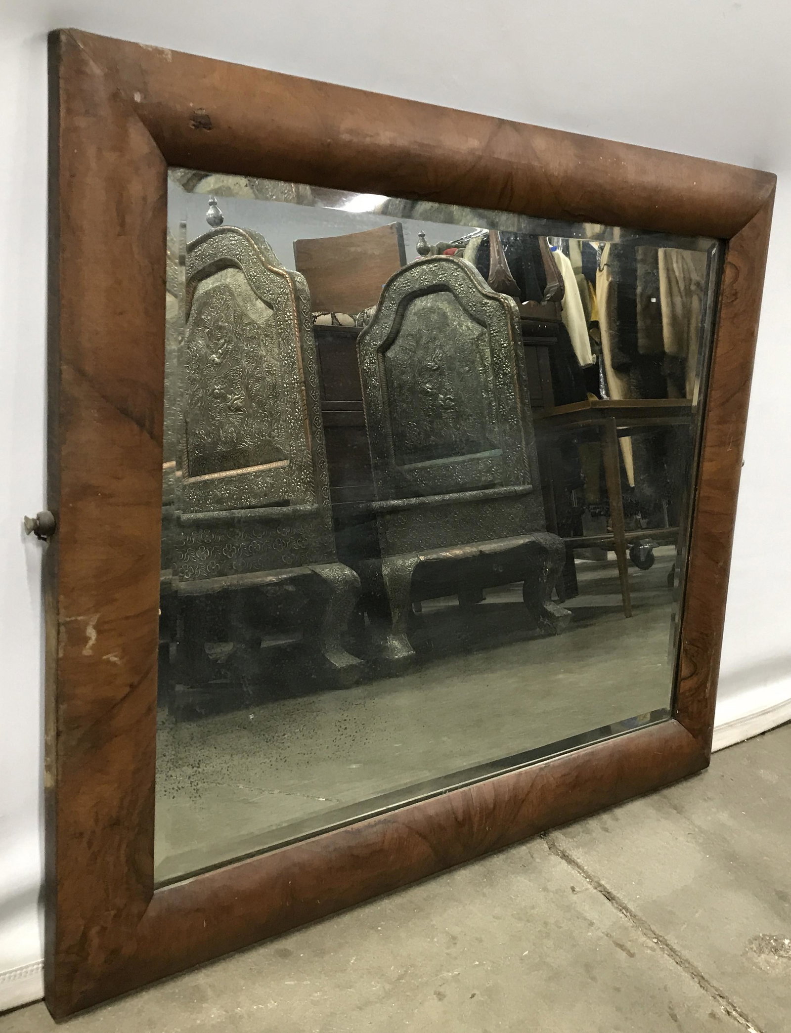 Vintage Beveled Wooden Frame Mirror: Mirror frame is wooden. Mirrored surface is beveled. Mirror frame has light brown beige tone. Piece measures approximately 29 inches long 25.5 inches tall. Mirror, wood frame mirror, beveled mirror, v