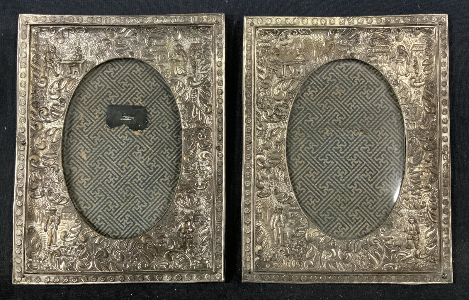 Pair Decorative Japanese Picture Frames: Pair Decorative Japanese Picture Frames, inscription to interior of frame reads ‘Made in Japan’, silver toned metal, Subject scenes of Dutch villagers, both measure 7 3/8 x 5 3/4 inches, some tarn