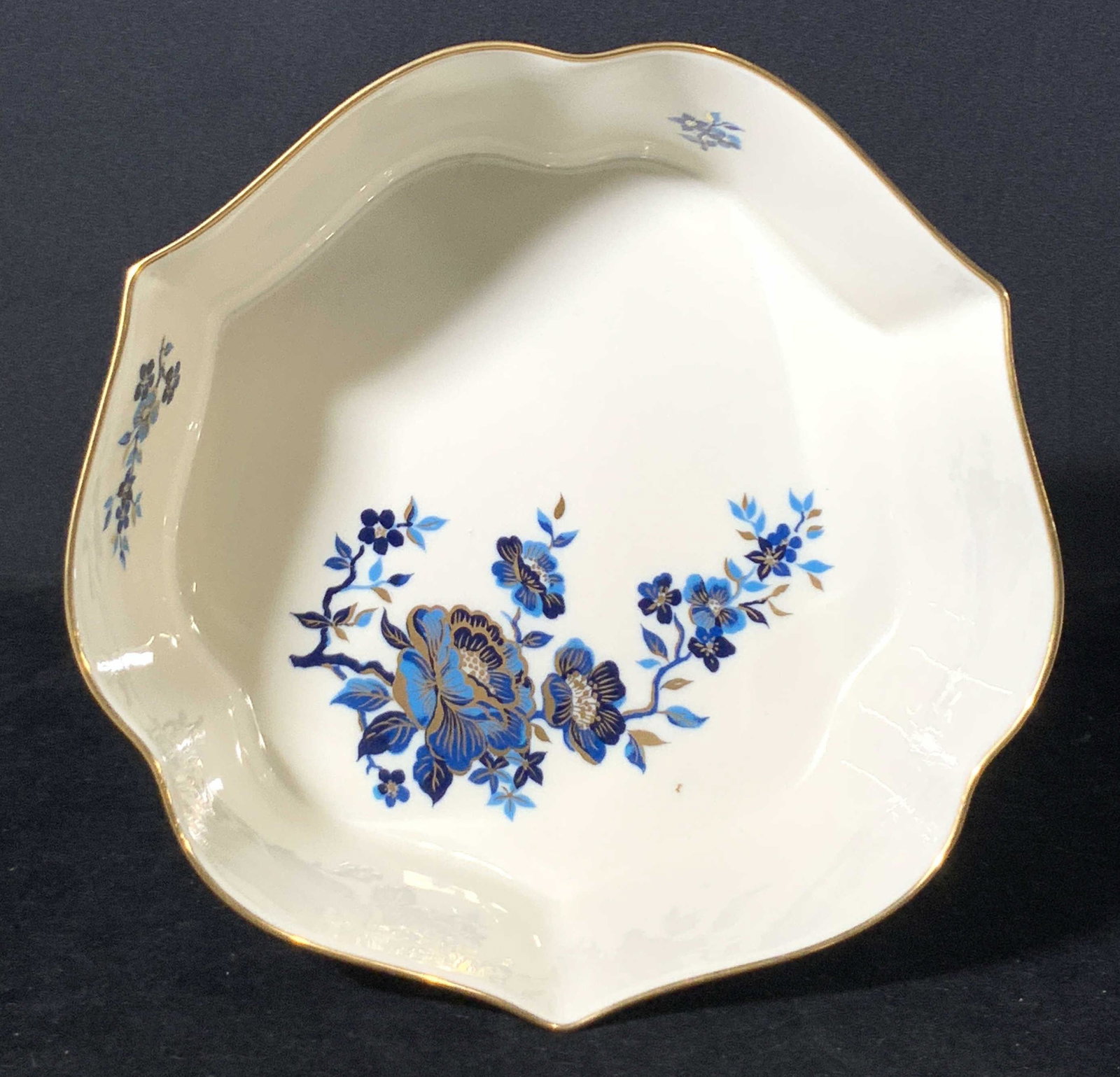 Signed LENOX Porcelain Centerpiece Bowl: Signed Lenox porcelain bowl with blue floral detail and gilt line work. Fluted shaped bowl. Underside reads: Lenox, Pagoda, Made in USA Approx. width 9 in. Approx. height 3.25 LENOX, Lenox bowl, Porce