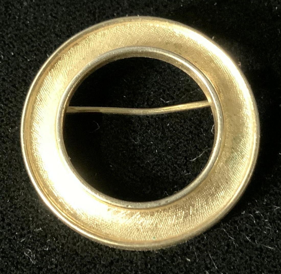 Vintage Trifari Gold Toned Pin: Vintage trifari gold toned pin, inscription to pin reads ‘Trifari’, gold toned metal, circular shape, has some scratches but overall in good condition, Vintage, trifari, gold toned, pin, women’s