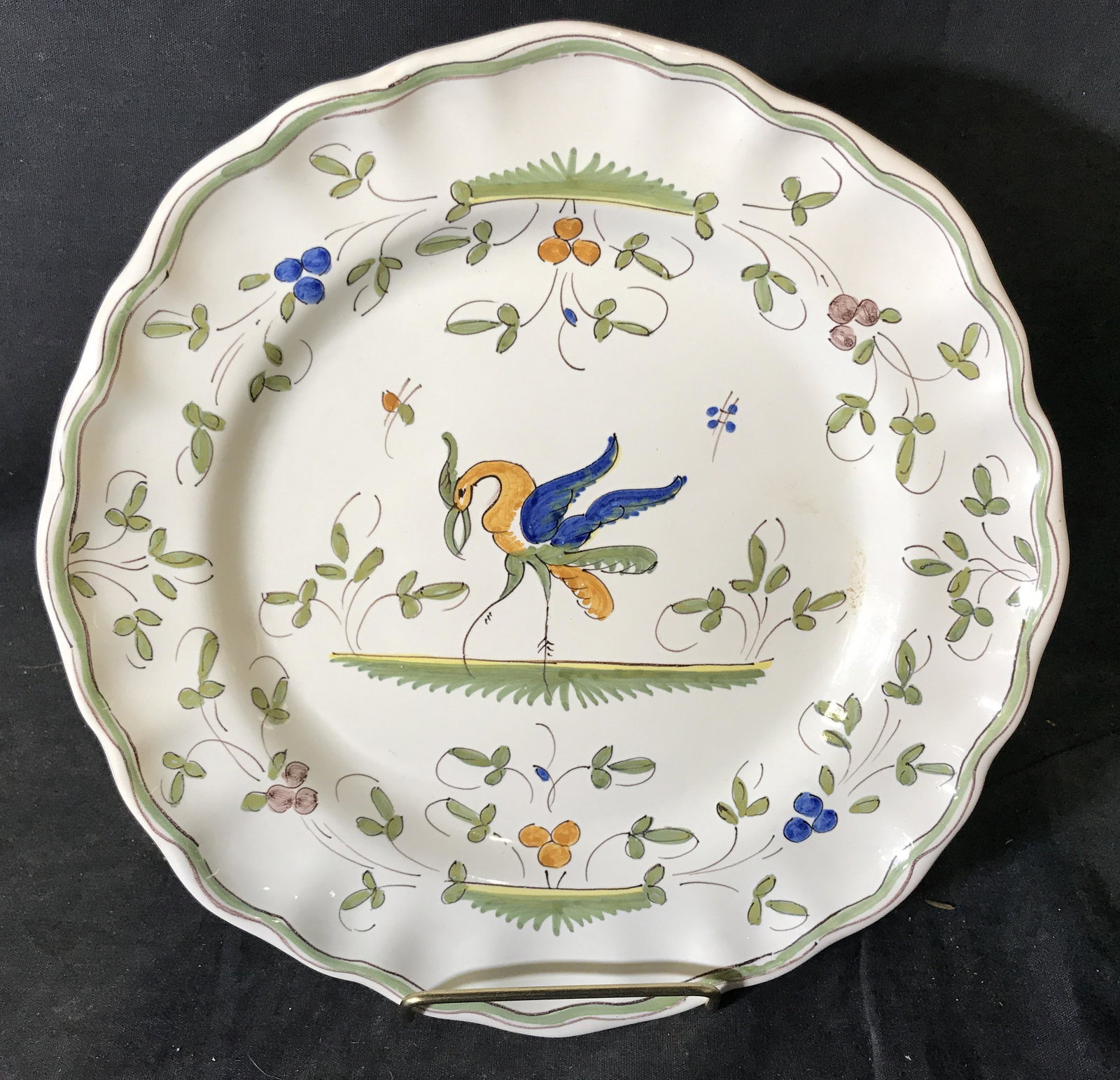 Matet Fait Main French Porcelain Plate: Matet Fait Main French Porcelain Plate, label to reverse reads ‘Matet France Fait Main’, Hans painted surface of plate, front displays a bird and other floral designs in green orange and blue, pla