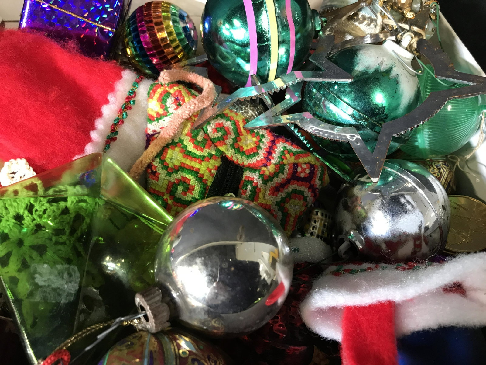 Group Lot 100 Vintage Christmas Ornaments Plus: Group lot 100 Vintage Christmas ornaments plus, lot contains a wide variety of different Christmas ornaments and 12 multicolored coins, ornaments range from glass to beaded to plastic, some hand made 