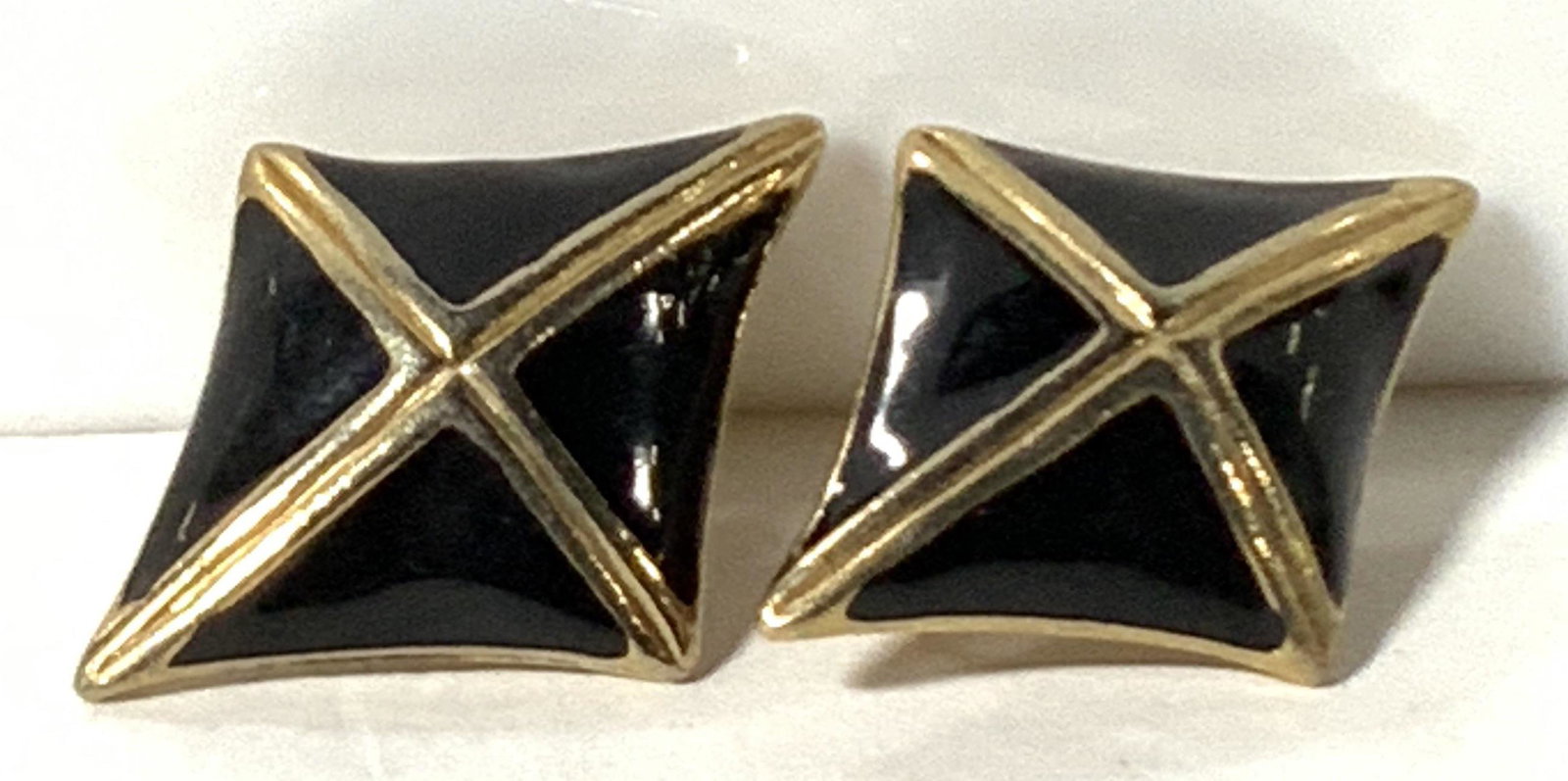 Diamond Shaped Gold Toned & Black Earrings: Diamond shaped enamel gold toned & black clip on earrings. Approx. 1.5 in. length. Approx. 1 in. width. Costume Earrings, jewelry, Clip On Earrings, Statement Earrings, Ladies Accessories, Ladies wear