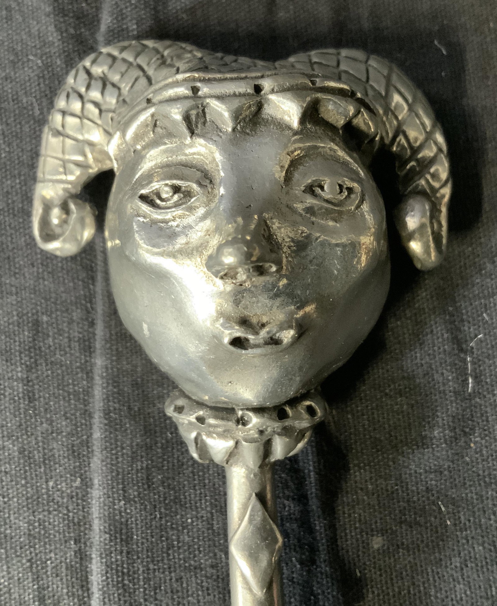 Jester Figural Metal Accessory: Jester shaped metal accessory, spoon shae, no apparent inscriptions or stamps, silver toned metal, measures 7 1/2 inches x 2 1/8 inches at widest point, some scratches but overall in good condition, J