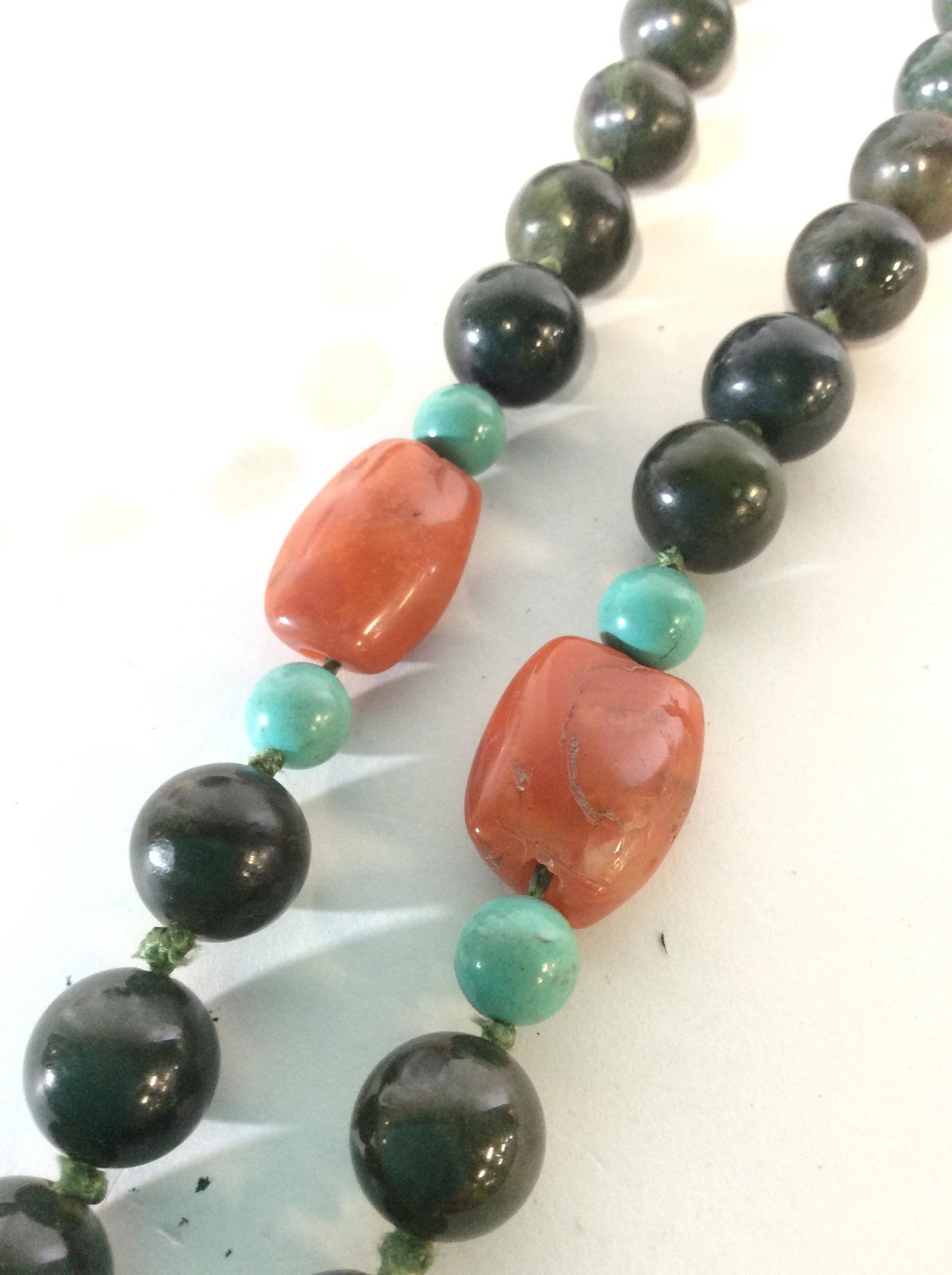 Beaded Stone Hand Strung Necklace: Hand Strung Beaded Arts & Crafts Necklace. 11 mm Natural green quartz rounds accented by turquoise rounds and polished carnelian quartz. 24 in. Weighted piece. Quartz Necklace, Green, Semi Precious St
