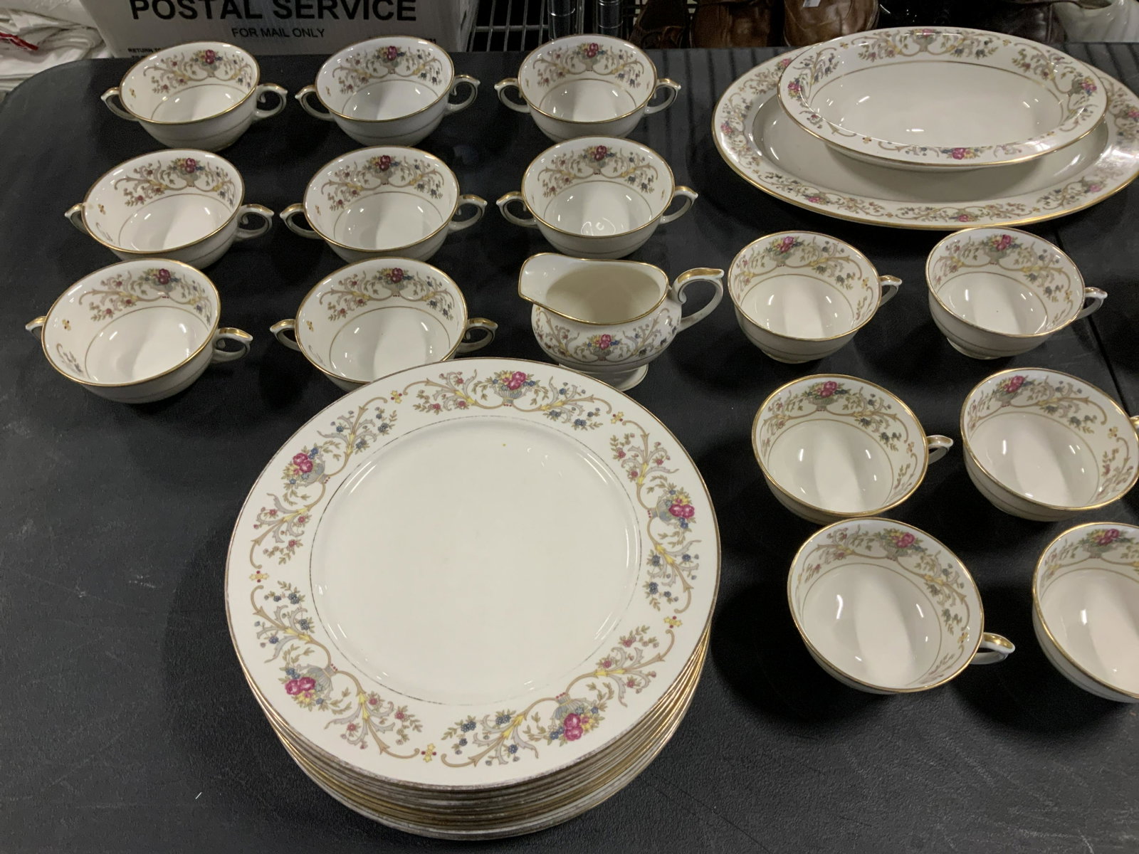 Lot 50 Lamberton China Set: Lot 50 Lamberton China Set, stamp to base reads ‘Lamberton China made in America Dorothea’, painted gold rims, floral design, teacups measure 2 1/4 inches tall x 4 5/8 inches wide, smallest saucer