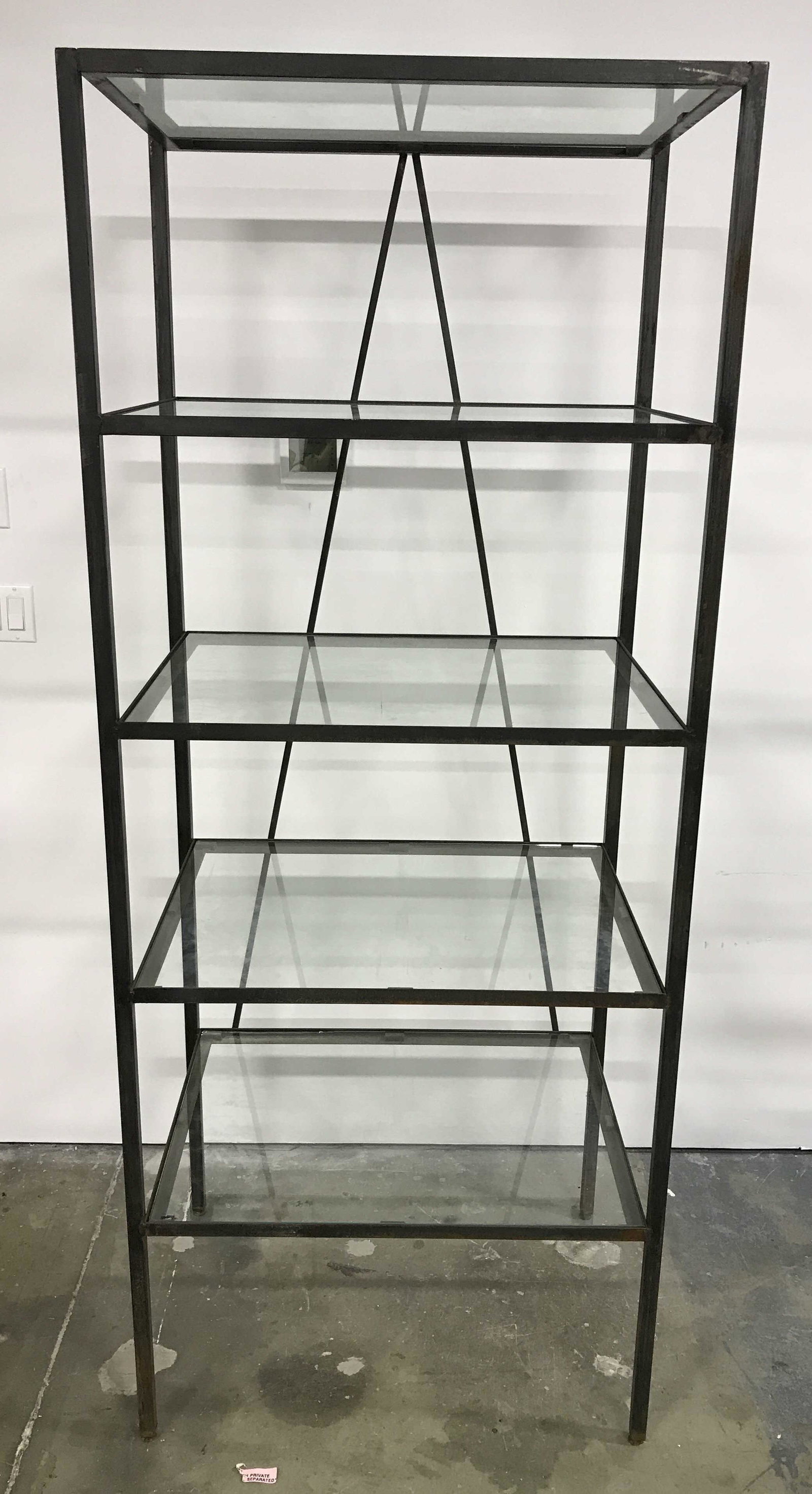 Vintage Glass Shelved Display Rack: Vintage metal display rack with glass shelves. The rack hold five glass shelves. Minor chipping is present. One of the glass shelves has heavily chipped along the edge and is sharp, caution is require
