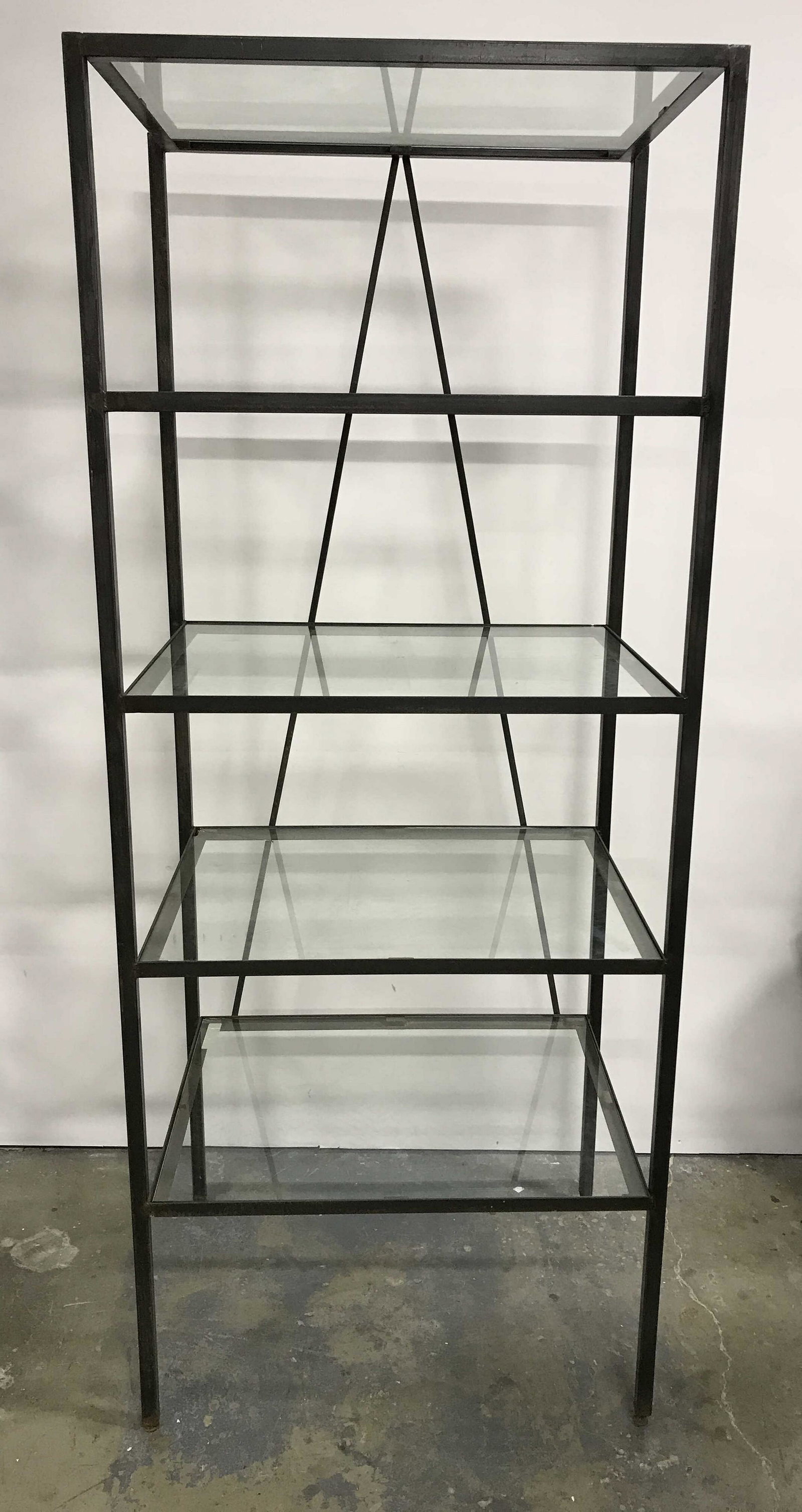 Vintage Glass Shelved Metal Rack: Vintage metal display rack with glass shelves. The rack hold five glass shelves. One of the glass shelves has chipped along the edge and is sharp, caution is required when handling it. Chipping is pre