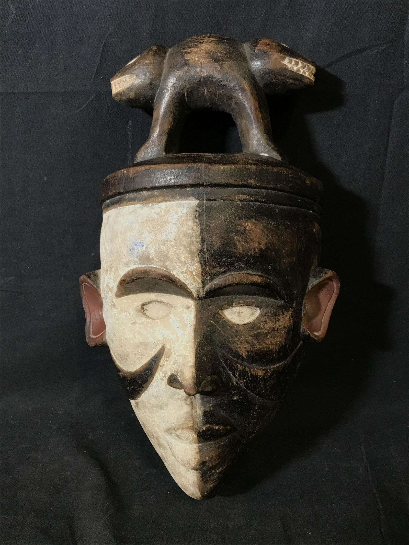Black and White Yombe Face Mask: Black and White Yombe Face Mask, origins found in what was previously known as the Republic of Zaire a section of land that is now apart of the Democratic Republic of the Congo, painted with white bla