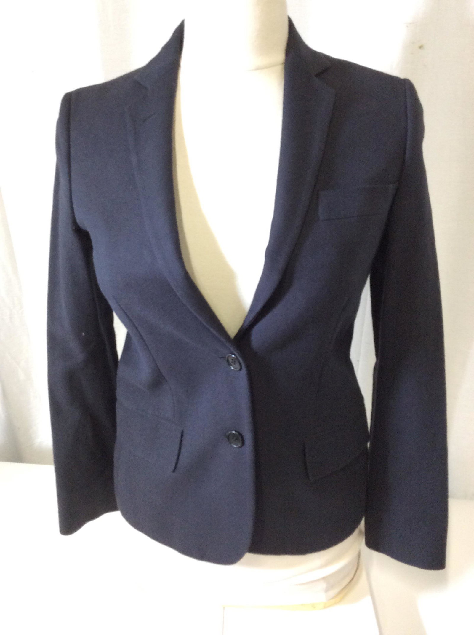 Helmut Lang Italian Woven Cotton Blazer, Italy: Luxury Designer. This navy blue blazer is Italian Made by expert seamstresses, Sz 38, acetate lining, inner ticket pocket, faux flap pocket. Labeled Helmut Lang near inner pocket. care instructions la