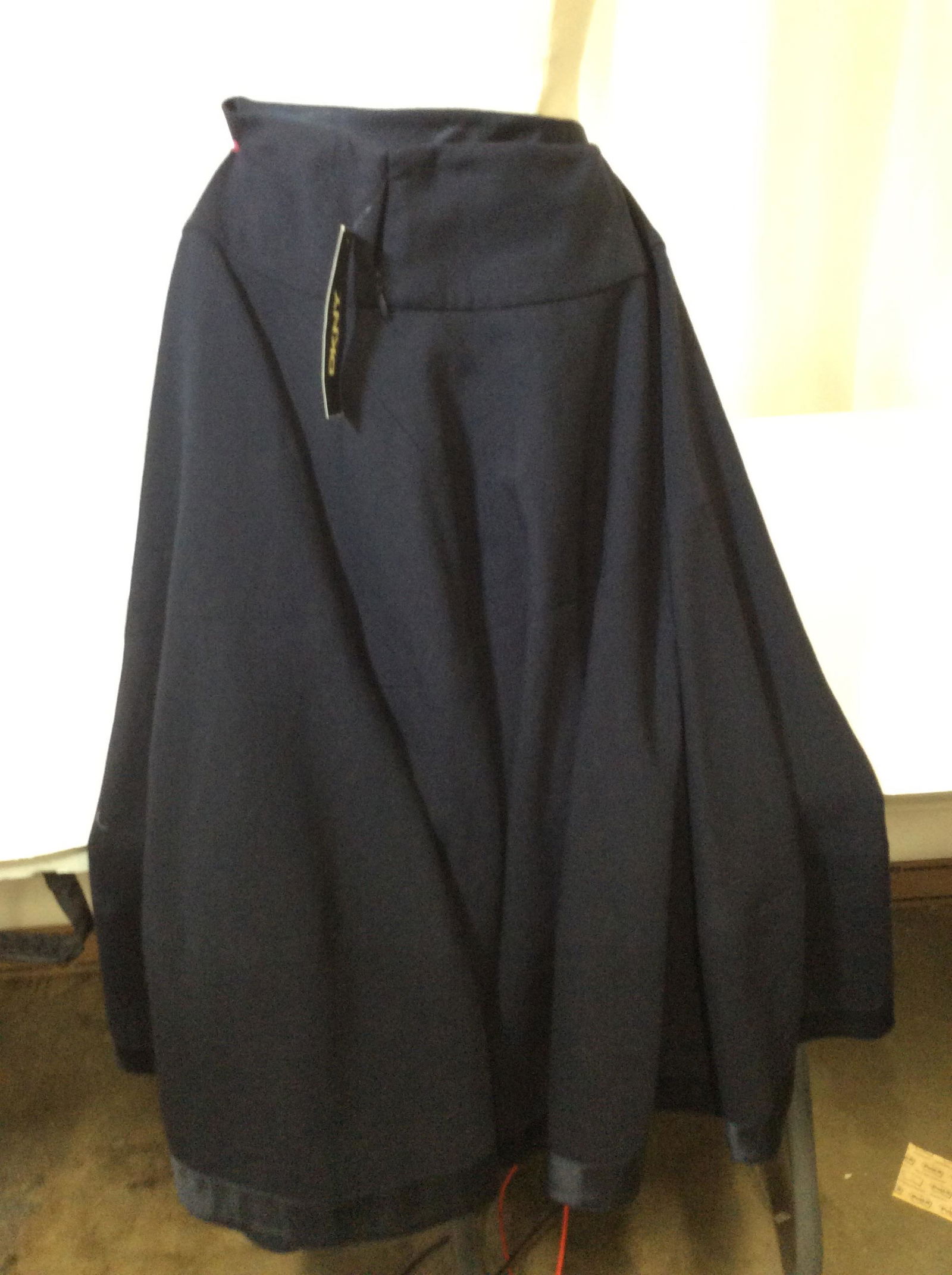NWT, DKNY Navy Blue Wool Skirt, Luxury Ladies: Luxury Fashiion Designer Donna Karen, with Original tag attached , Sz 2. Designer Labeled , MADE OF 97 % wool with stretch. Short Back zipper, 30in long. Professional Wool Skirt, Navy Blue wool skirt,