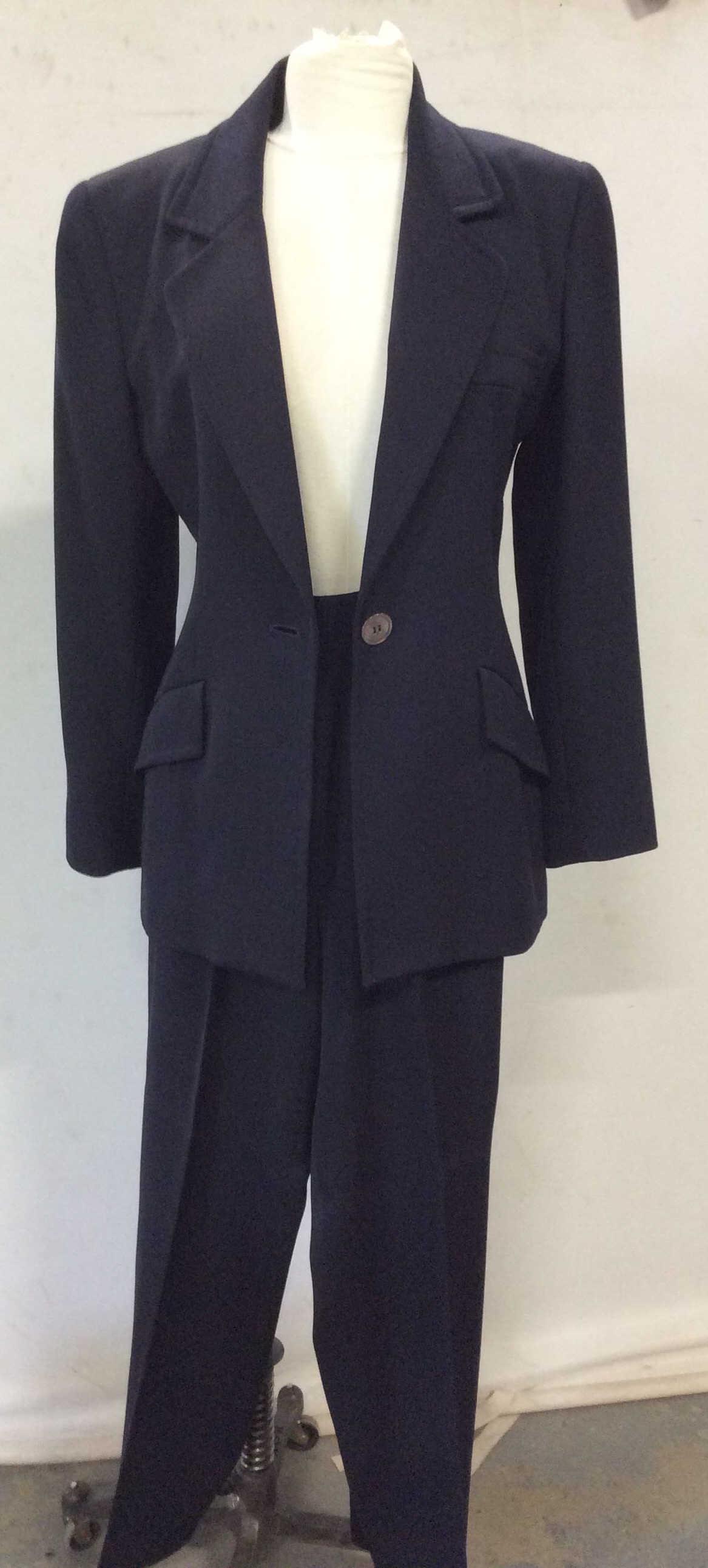 Vintage CAROLYNE ROEHM Wool Pantsuit: Designer Suit in navy blue, size 6 both pieces, designer labeled on brother jacket and pants with fabric listed as 100% wool. Both lined. Trouser inseam 28.5 in. good vintage condition. Luxury Wool Su