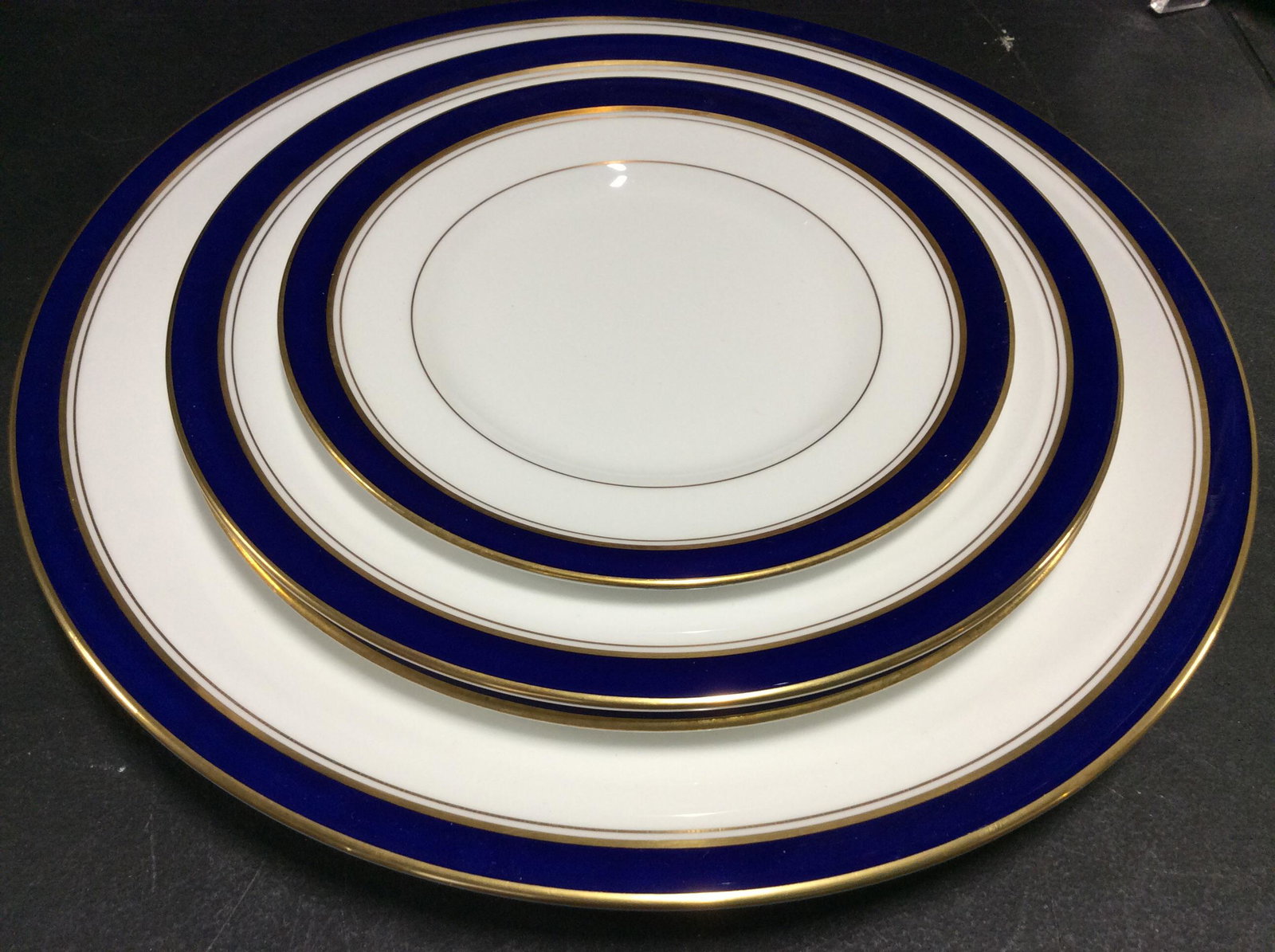 Royal Worcester ‘Howard’ Chinaware Set, England: 42 pcs total. Fine bone Chinaware, Royal Worcester Howard Pattern, White Porcelain with cobalt blue and gilt rims. Exquisite set, most pieces in original packaging and many pieces appear seldom or un 