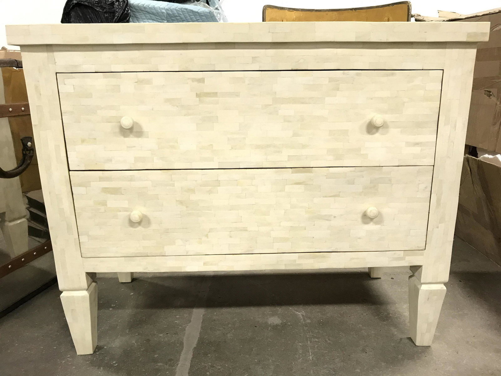 Inlaid Bone Mosaic Dresser: Dresser has inlaid bone mosaic. Piece is cream toned. Contains 2 drawers each with knob style handles. Piece measures approximately 42 inches long 34 inches tall 20inches deep. Dresser, mosaic dresser