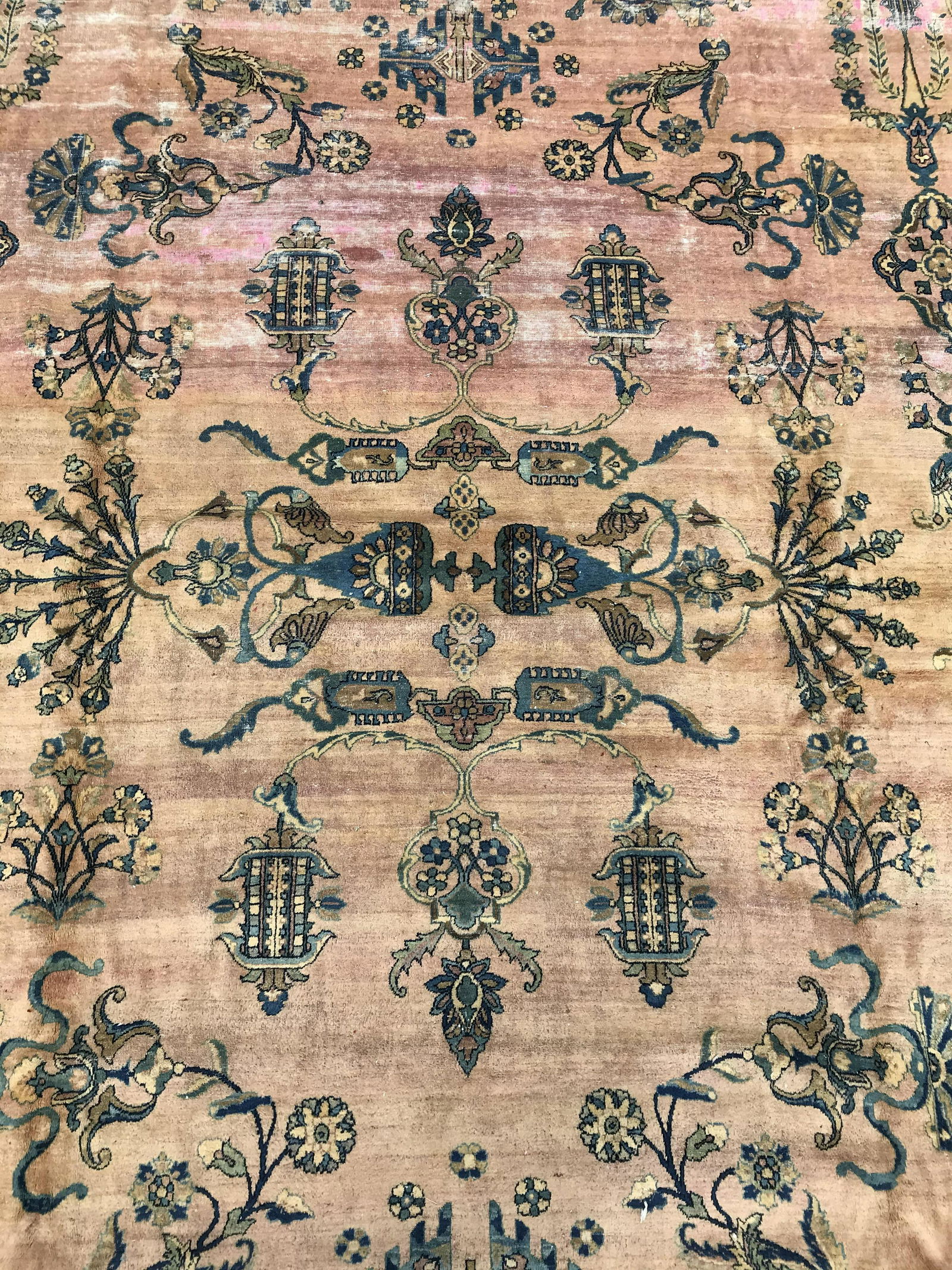Antique Handmade Persian Wool Rug: Rug is wool and handmade. Piece is antique. Contains intricate multi toned floral vine, and leaf detail. Rug measures approximately 185 inches long 125 inches wide. Rug, carpet, area rug, wool rug, ha