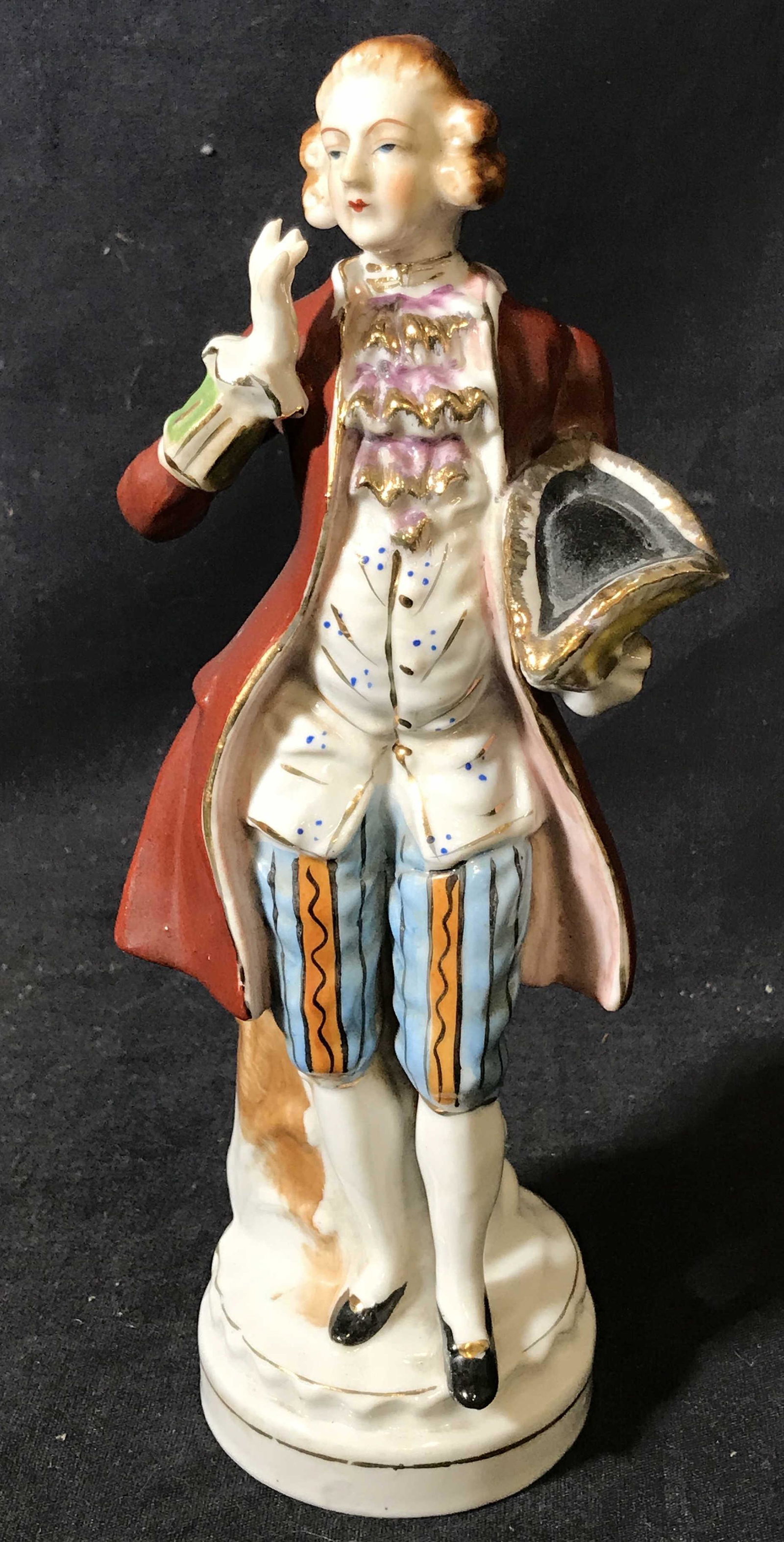 Hal-Sey Fifth Japanese Porcelain Figurine: Hal-Sey Fifth Japanese Porcelain Figurine, stamp to underside reads ‘Japan, Hal-Set Fifth’, figurine depicts a man in 18th century French clothes holding his hat, measures 10 inches tall, hand pai