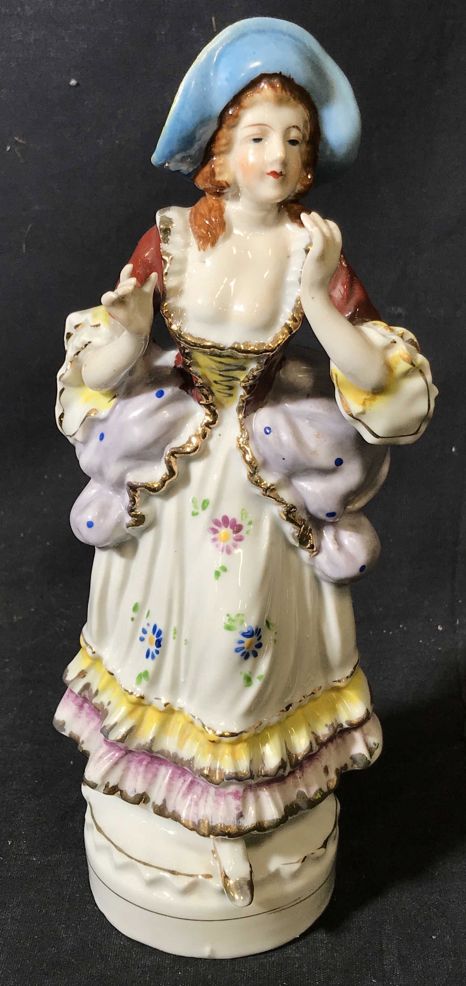 Hal-Sey Fifth Japanese Porcelain Figurine: Hal-Sey Fifth Japanese Porcelain Figurine, stamp to underside reads ‘Japan, Hal-Set Fifth’, figurine depicts a woman in 18th century French clothes with hands raised, measures 10 inches tall, hand