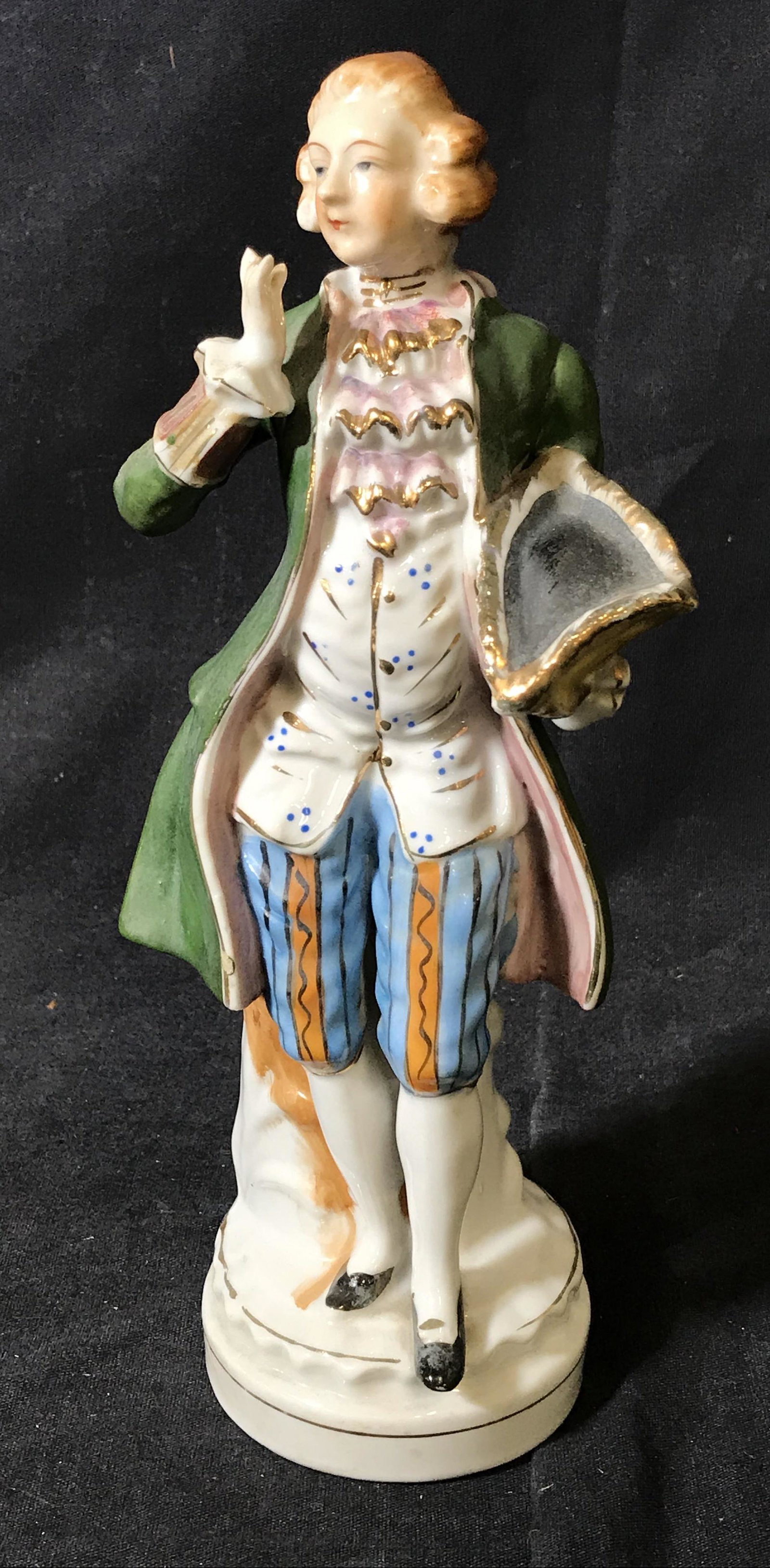 Hal-Sey Fifth Japanese Porcelain Figurine: Hal-Sey Fifth Japanese Porcelain Figurine, stamp to underside reads ‘Japan, Hal-Set Fifth’, figurine depicts a man in 18th century French clothes holding his hat, measures 10 inches tall, hand pai