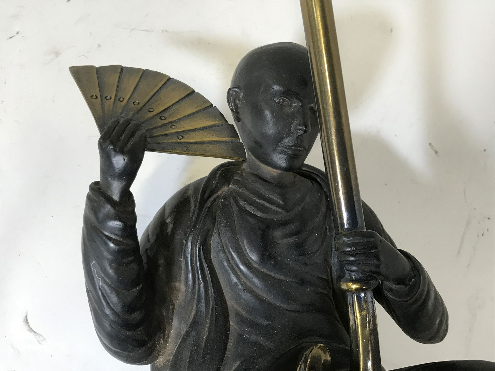 Bronze Male Figural Wall Sconce Lamp: Bronze Figural wall sconces lamp, label to reverse reads ‘Maitland-Smith Handmade In Philippines’, heavy weight object, lower section made of a dark wood, gold toned metal makes up top of lamp, do