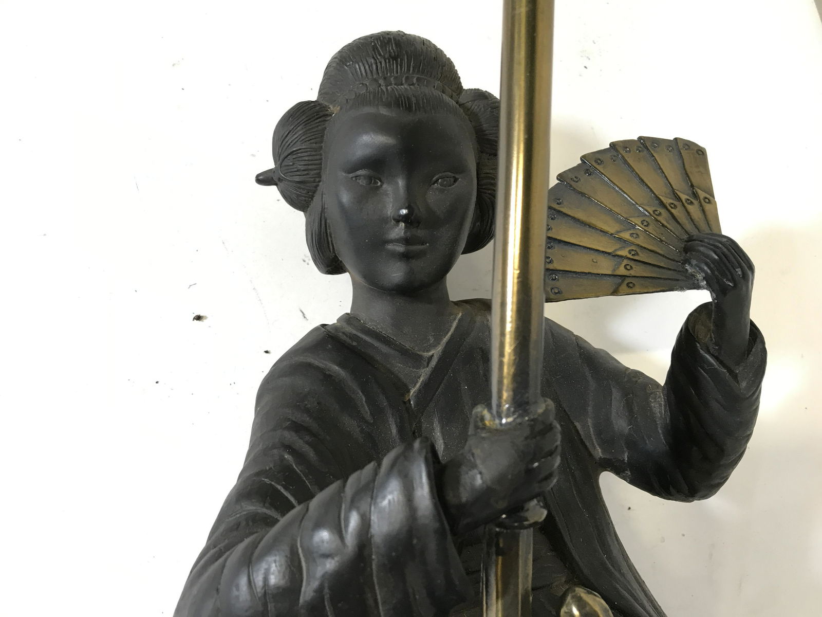 Bronze Female Figural Wall Sconce Lamp: Bronze Figural wall sconces lamp, label to reverse reads ‘Maitland-Smith Handmade In Philippines’, heavy weight object, lower section made of a dark wood, gold toned metal makes up top of lamp, do