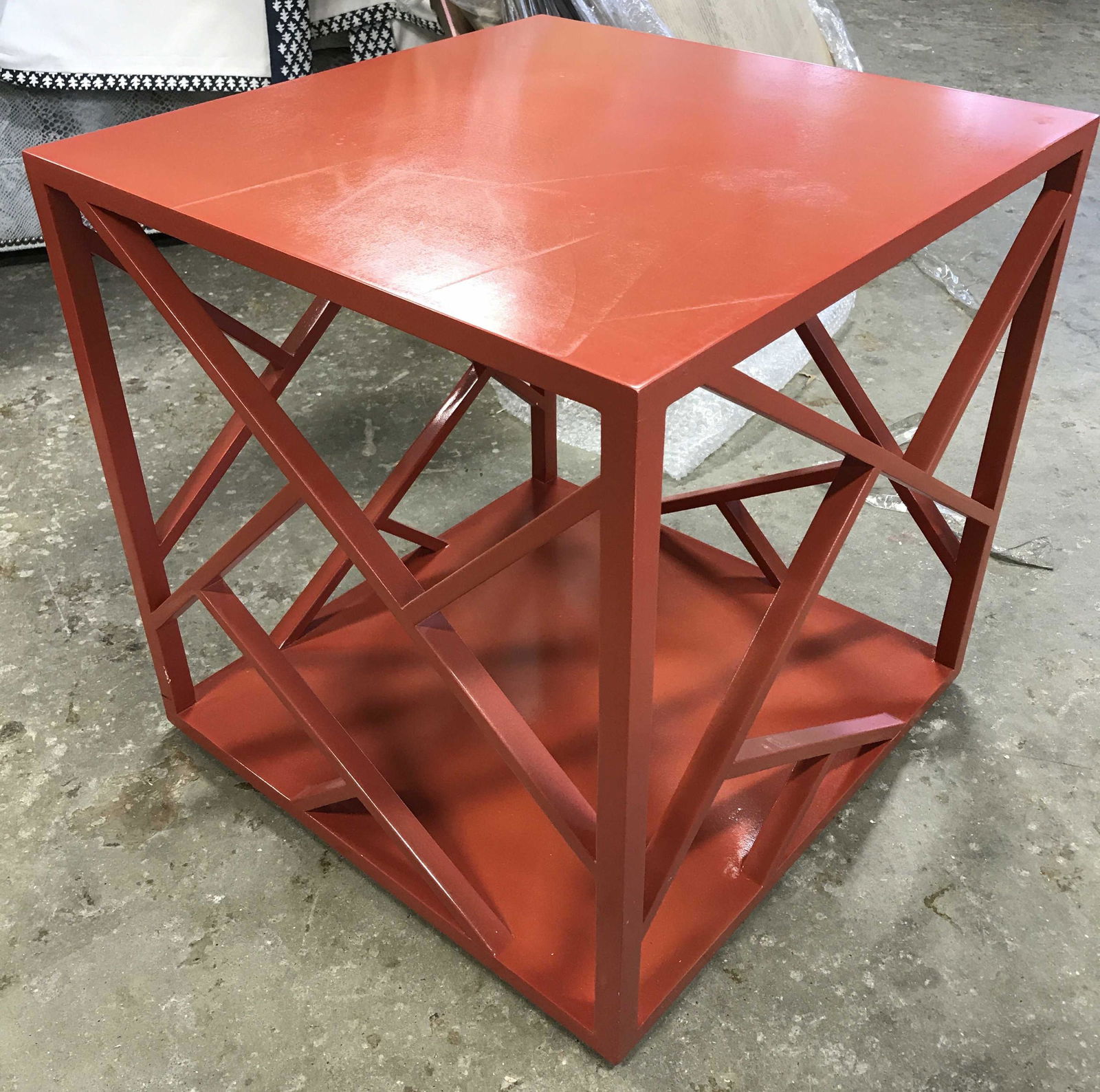 Tangerine Toned Lacquered Side Table: Tangerine toned side table. Cube shaped side table, Hong Kong Cubes from HB HOME. Measures approx 18.75 inches H, W, and deep. Table sides arranged to depict varying geometric shapes. Wear is consiste