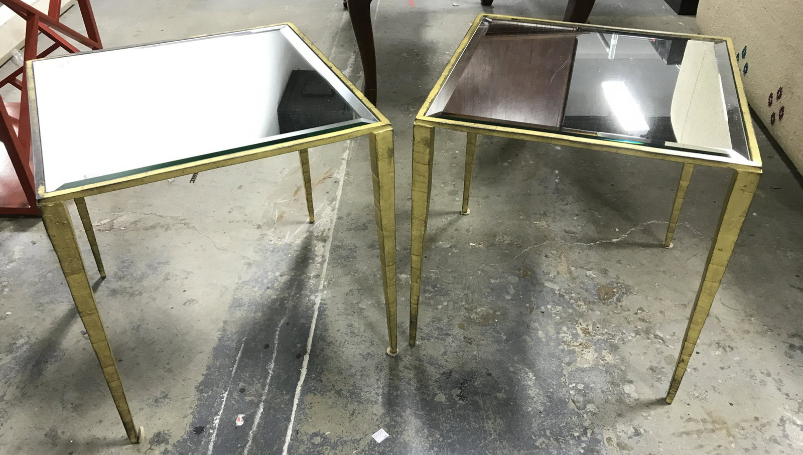 Pair Gilded Iron & Glass Side Tables: Pair of iron and glass tables, possibly vintage. Tabletop is glass, and is mirrored. Frame appears to be crafted from iron, and is gilded. Each table measures approx 16.25 inches H, and 15.75inches Wx
