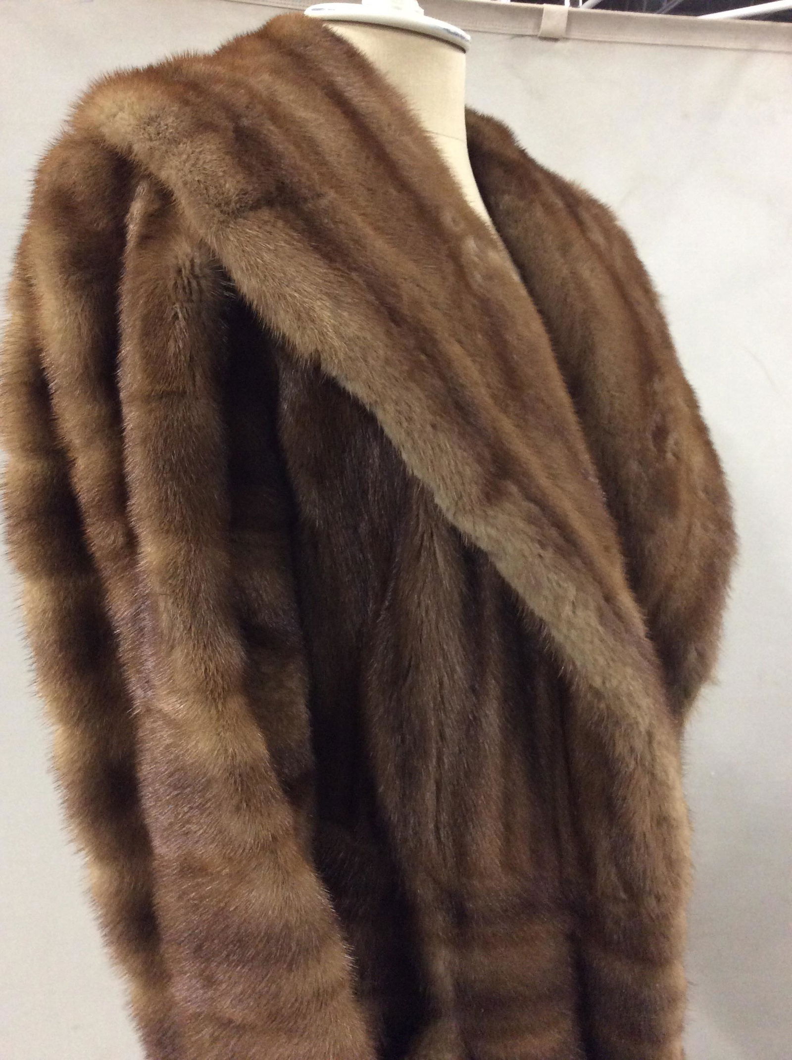 GOLDIN FELDMAN Med Brown Mink Coat: Stylistic Goldin Feldman Mink Fur Coat, has a bit of red in fur, 44 in long, app 34 in. waist. Exterior hand pockets with velour lining. Silk Champaign brown lining. Monogrammed. Ruffled lower hem. Wi