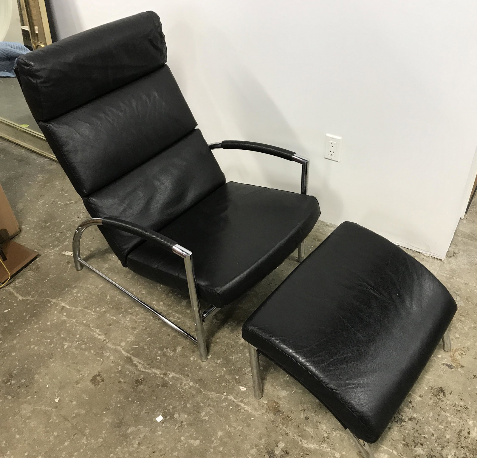 Mcm Leather Recliner & Matching Ottoman: MCM retro industrial style, vintage leather recliner with matching ottoman. Chair and ottoman are leather on a polished metal frame. Largest piece measures approx 38 inches H, and 25 inches W, 31 inch